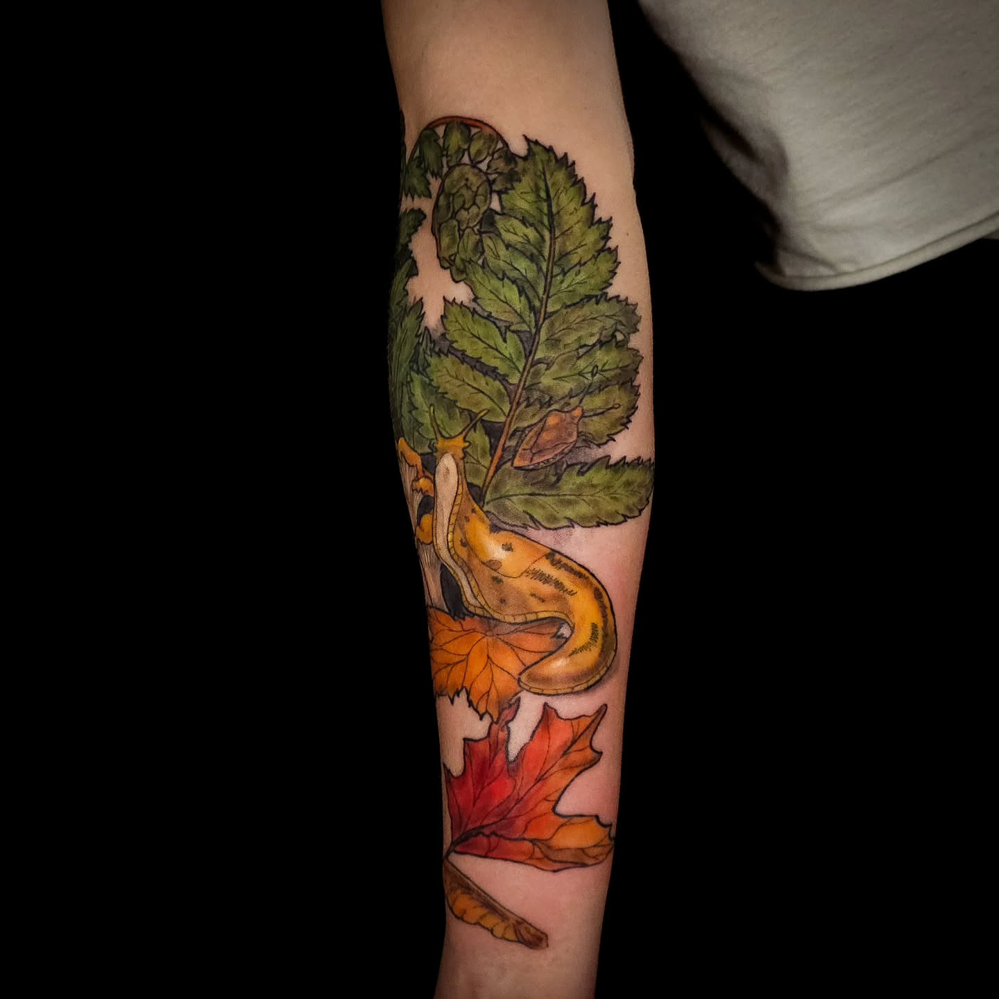 Snail and leaves realism tattoo on the forearm by Eva the Tattoo Fartist in Seattle, WA, Seattle, Washington