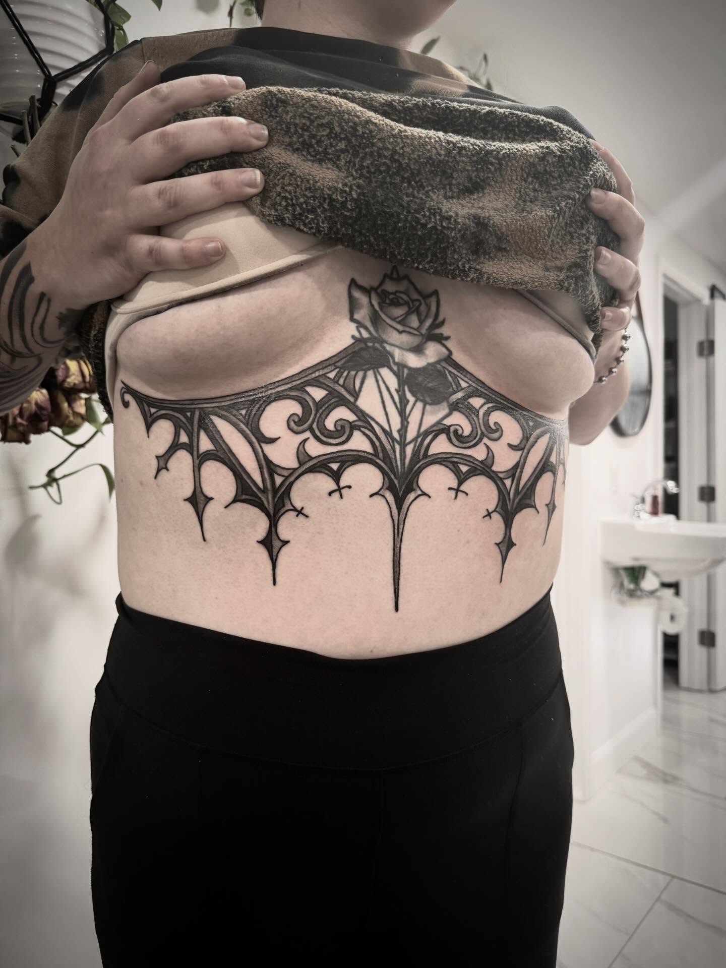 Gothic arches ornamental tattoo on the ribs by Shannon Misitano