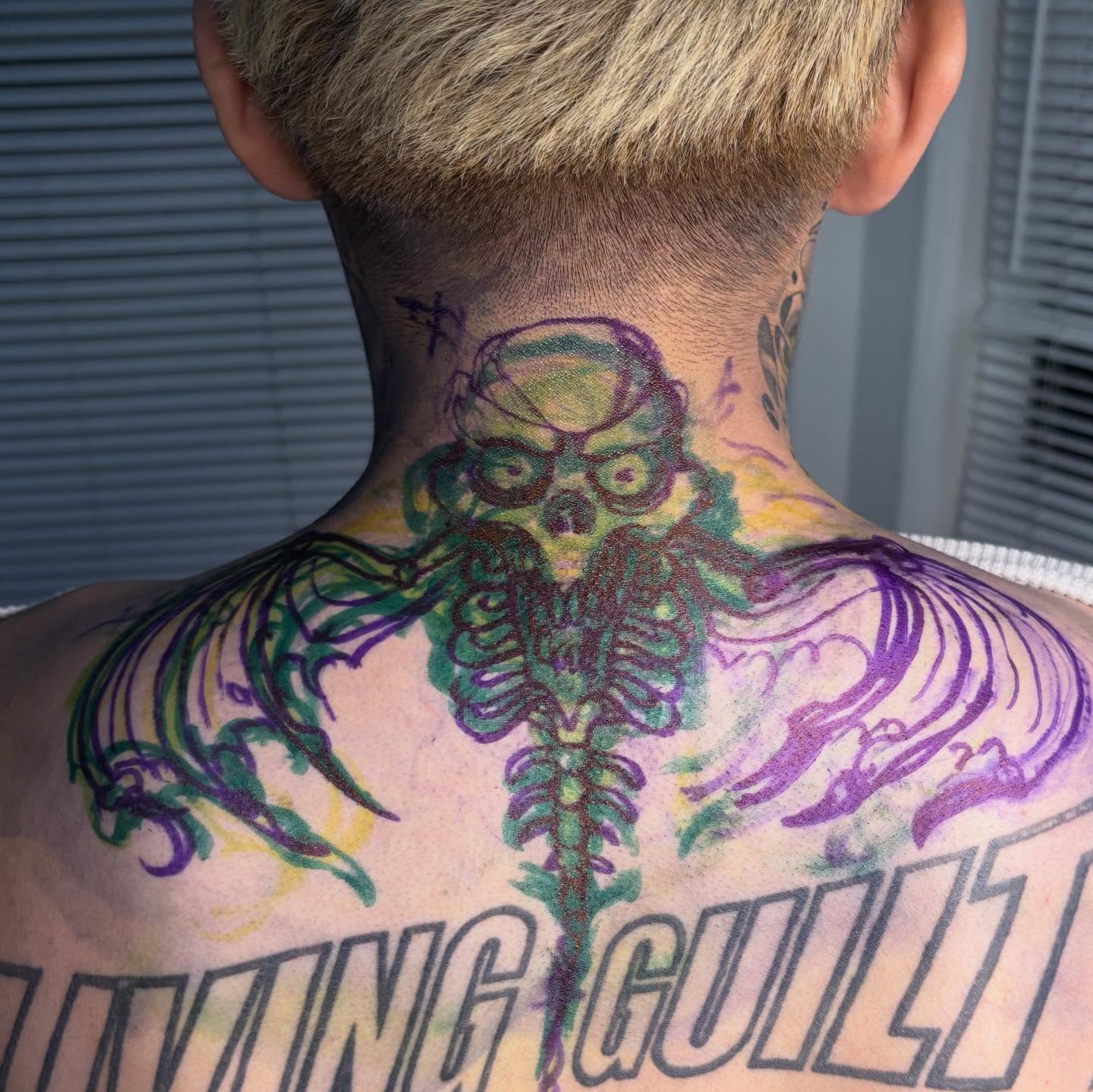 Skull with wings neo-traditional tattoo on the back by Brendan Smith