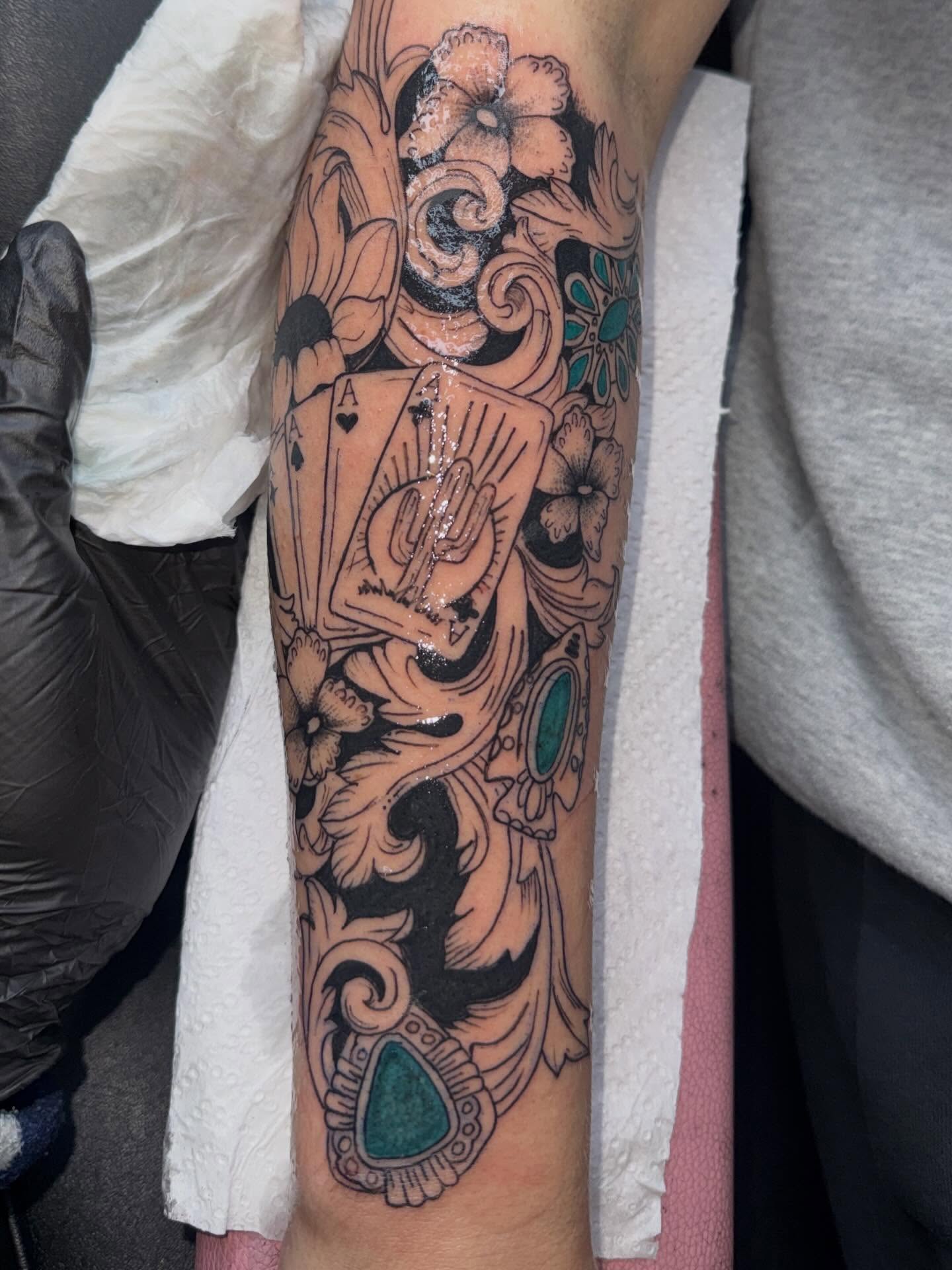 Ace of spades and floral ornament American traditional tattoo on the forearm by Destini