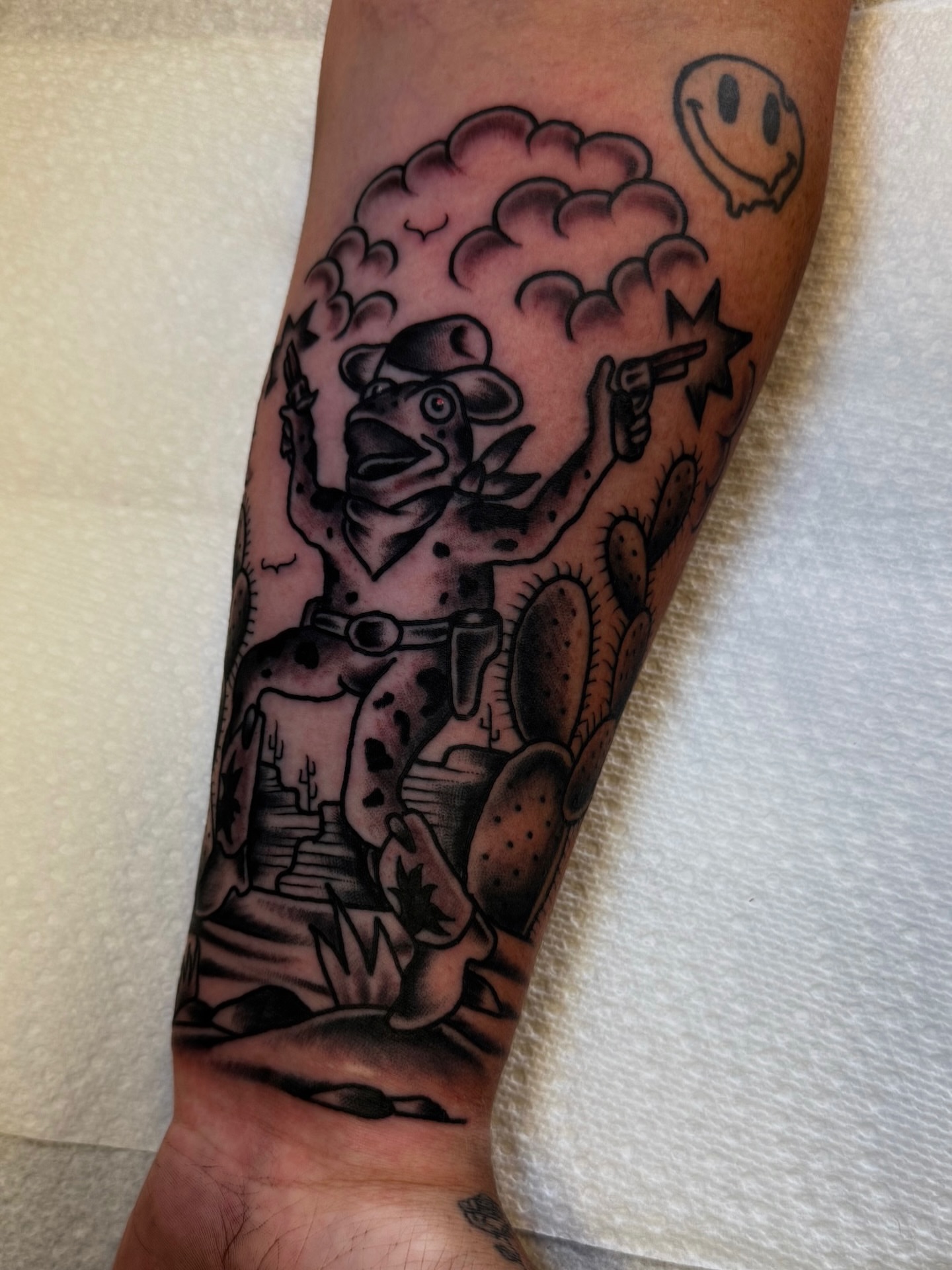 Cowboy dog American traditional tattoo on the forearm by Noah Diffenderfer, Phoenix, Arizona