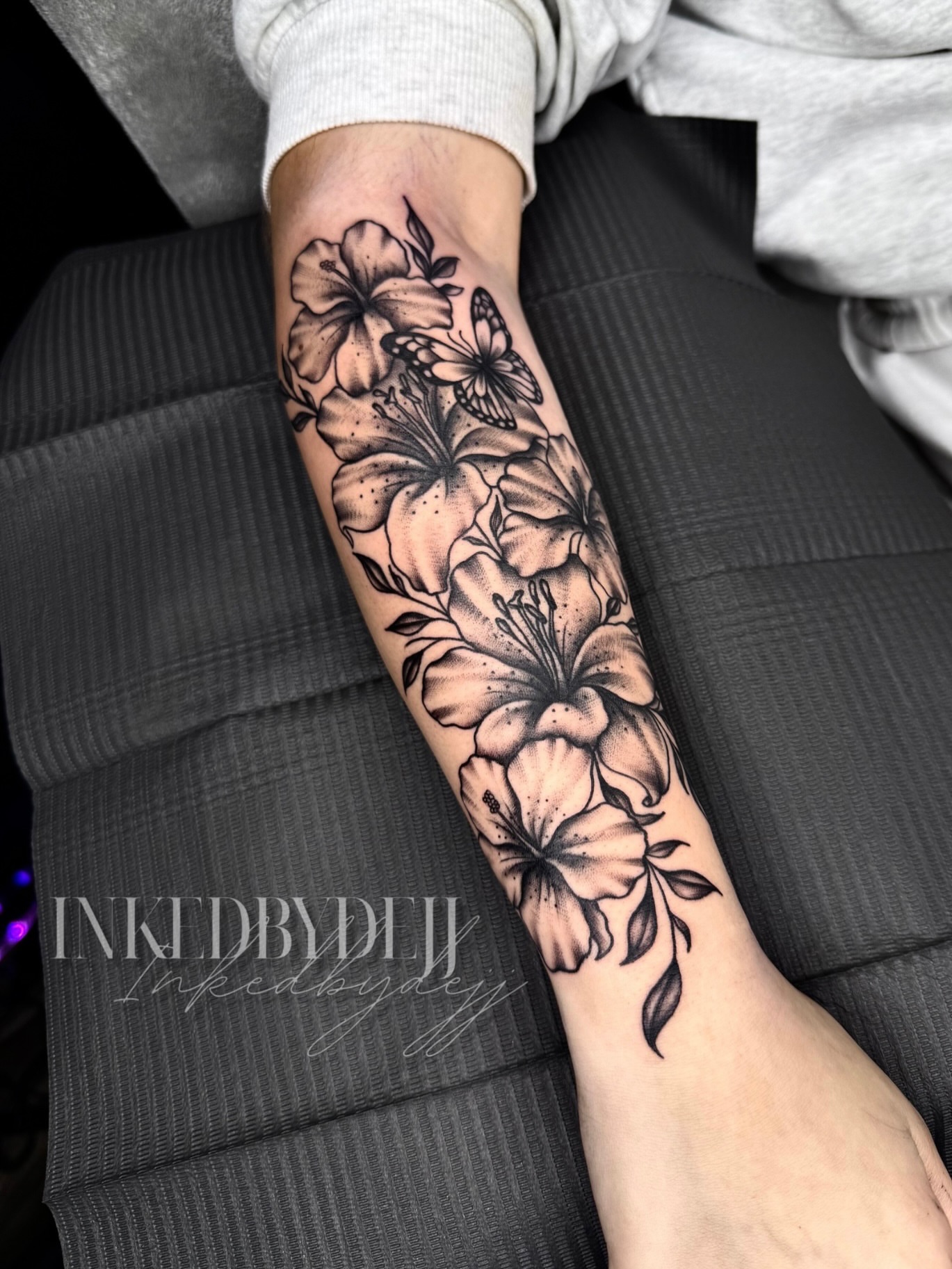 Floral arrangement dotwork tattoo on the forearm by Inkedbydejj