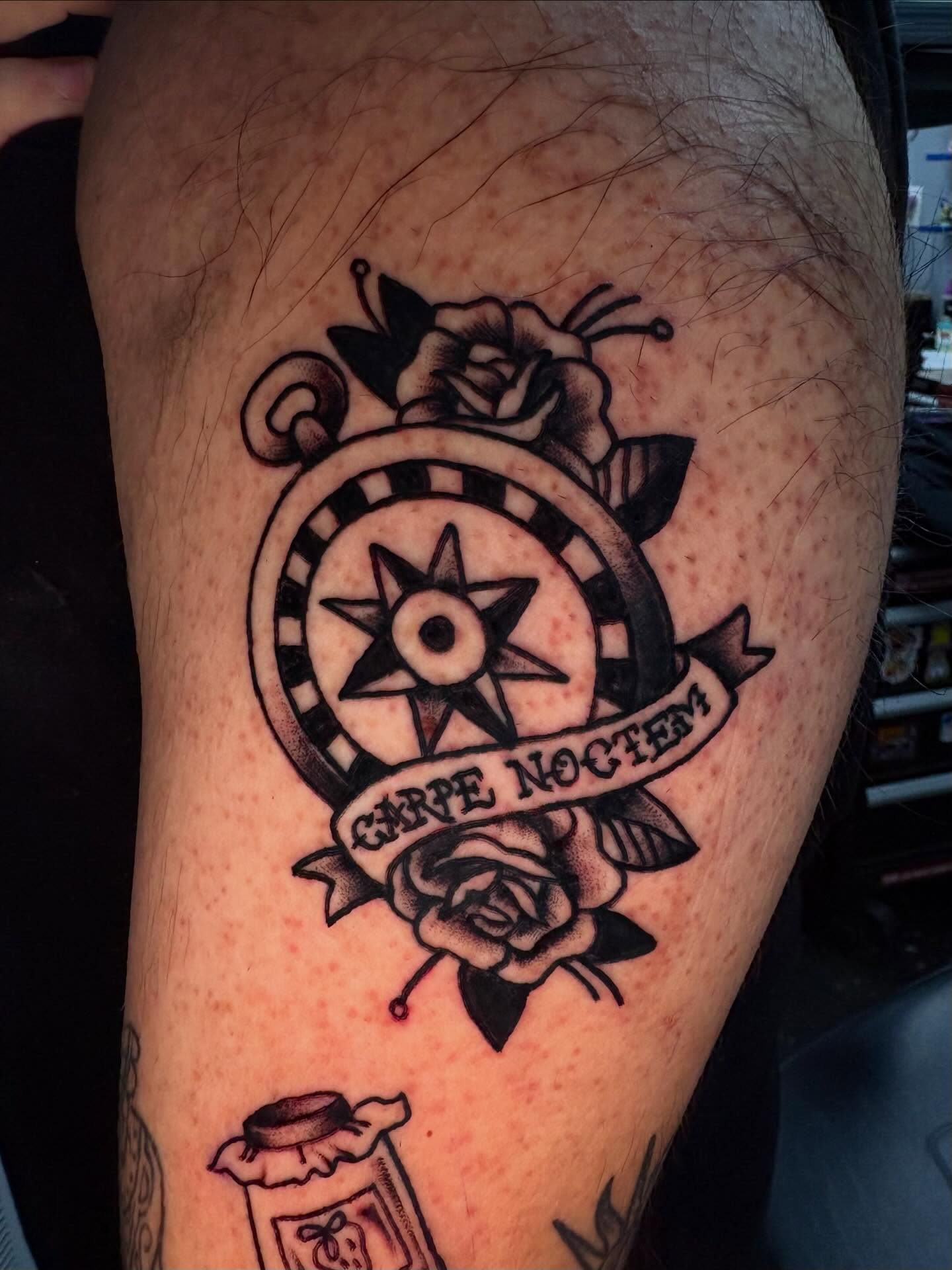 Compass and roses American traditional tattoo on the thigh by Jenna Clayton