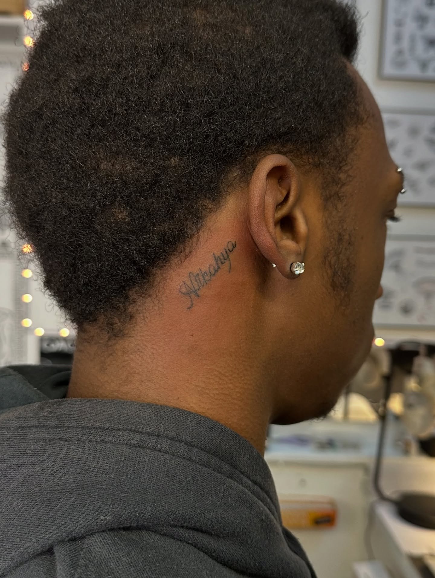 Script lettering lettering script tattoo on the neck by Piccolino, Cambridge, Massachusetts