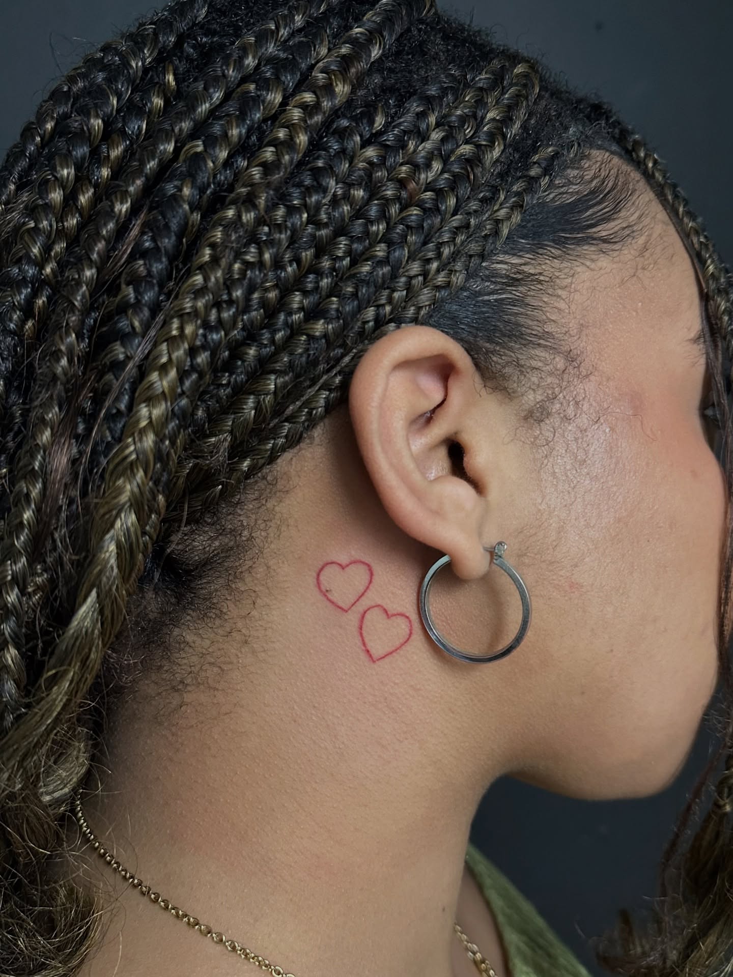 Hearts minimalist tattoo on the neck by Piccolino, Cambridge, Massachusetts