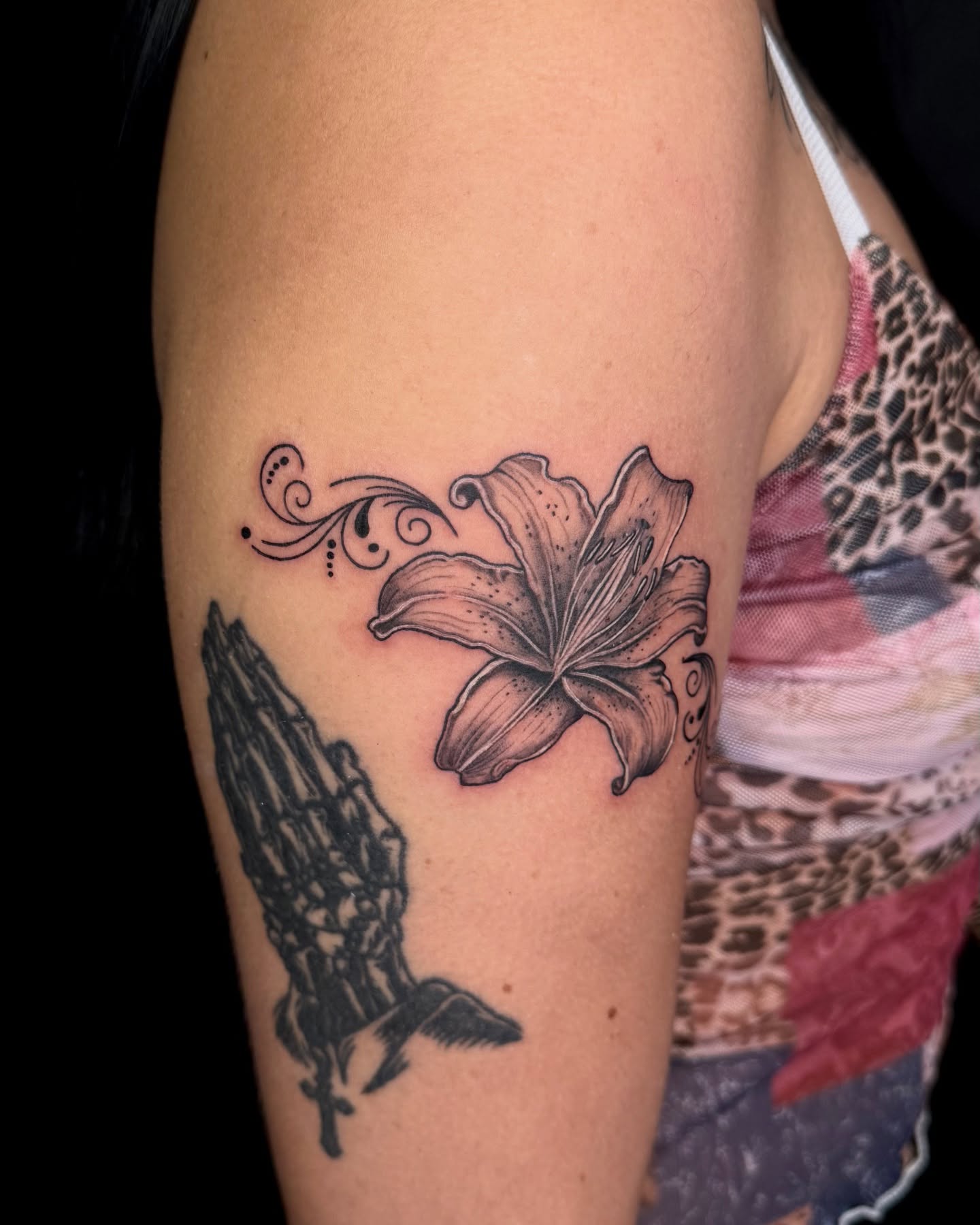 Lily black and grey tattoo on the forearm by Too Zen