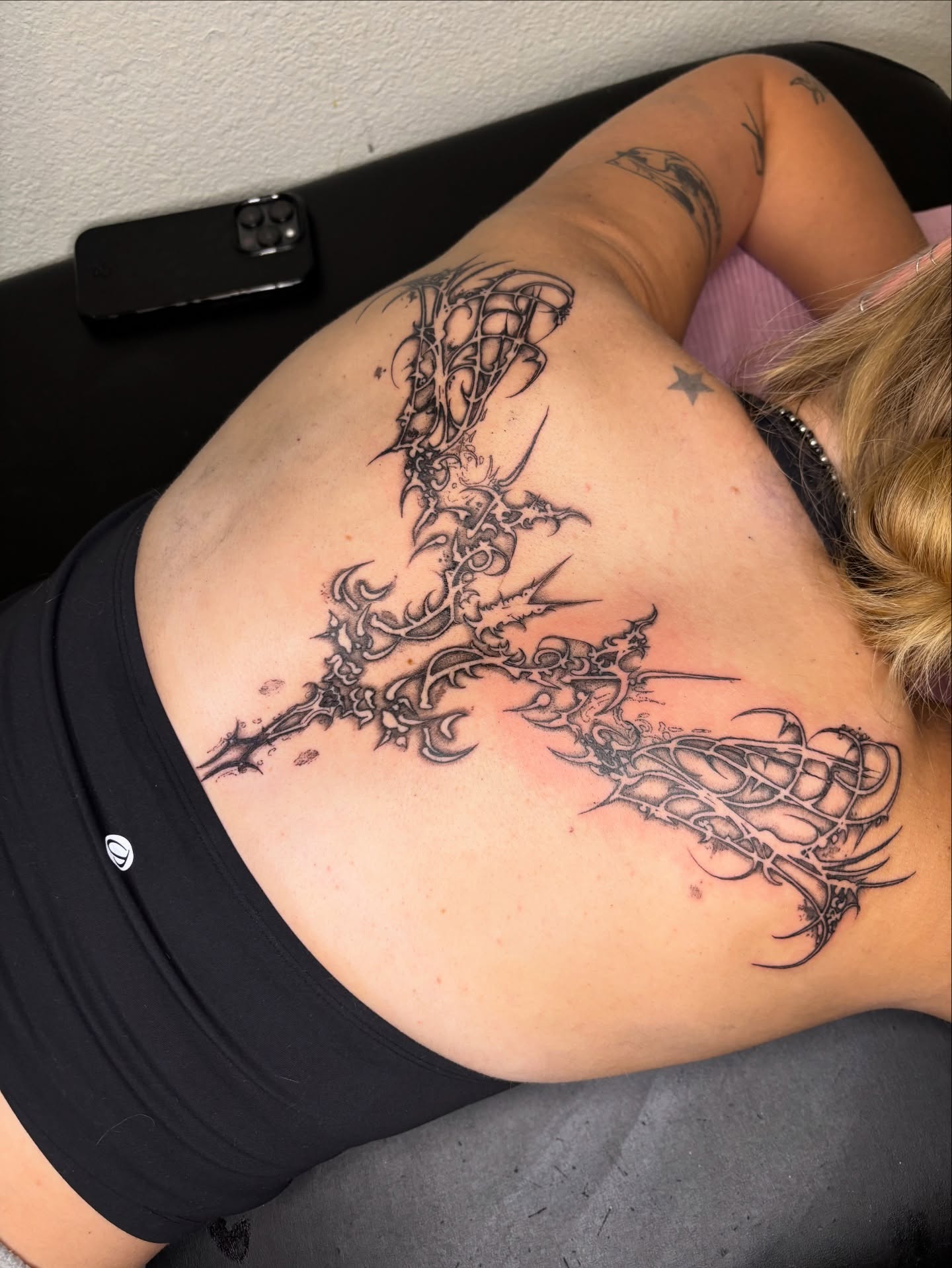 Spine tattoo black and grey tattoo on the back by @miffythereaper