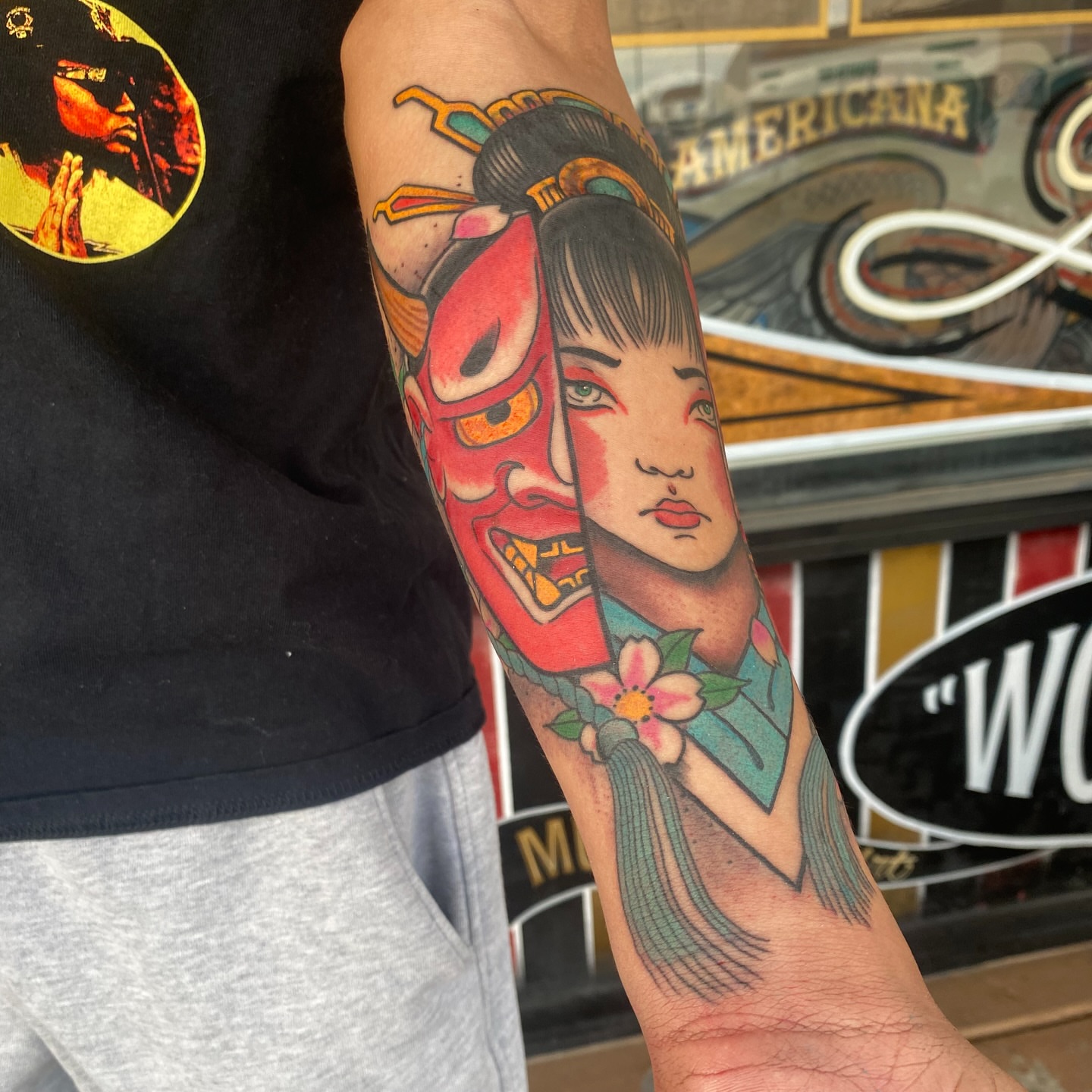 Geisha mask American traditional tattoo on the forearm by Nick Weaver
