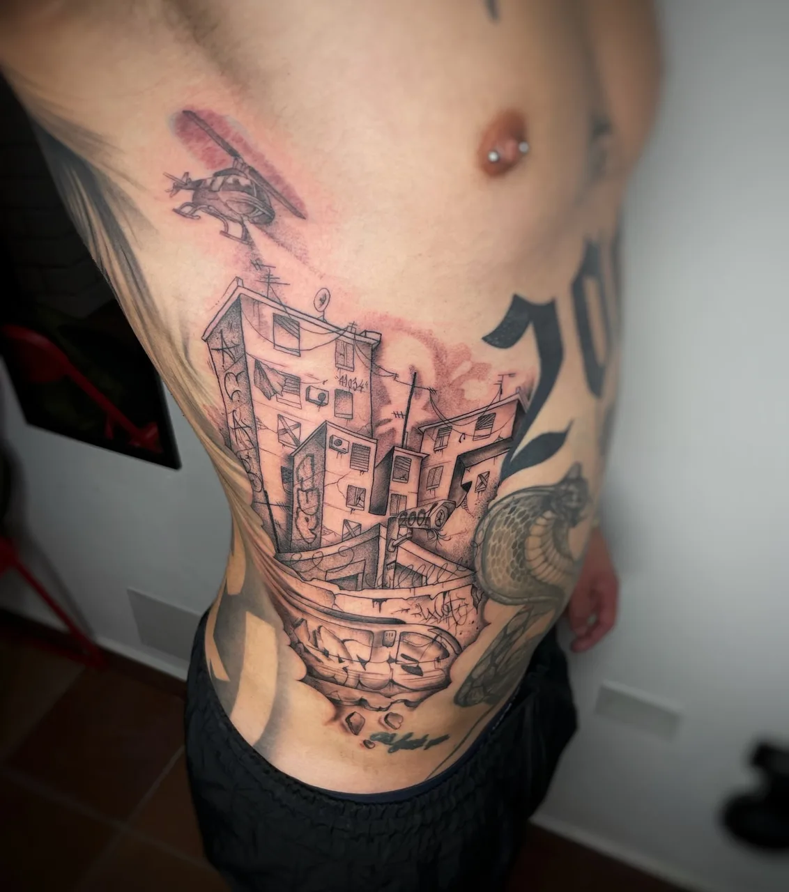 Urban landscape realism tattoo on the ribs by Blot_Tattoo
