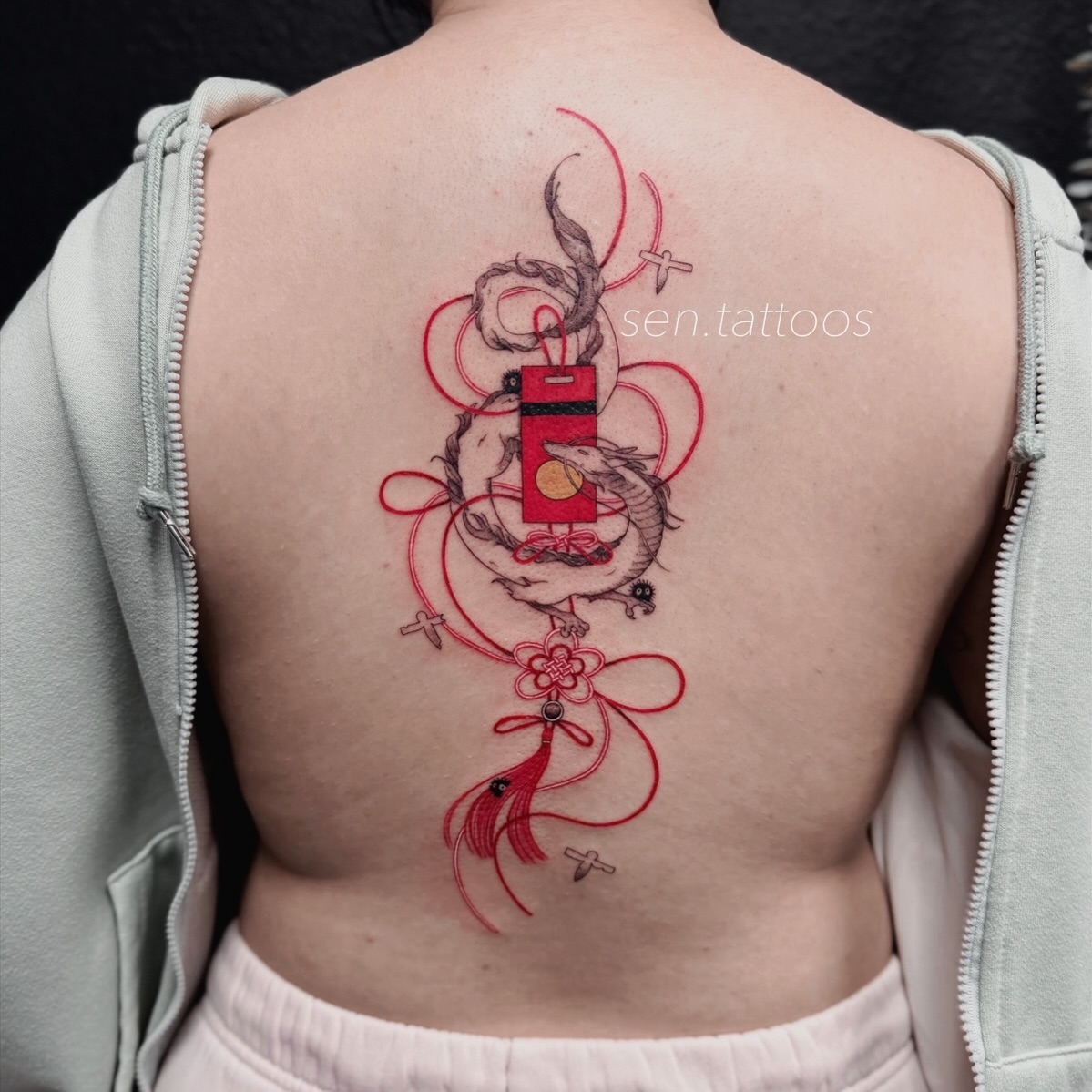 Dragon and lucky bag dotwork tattoo on the back by Sen Tattooer