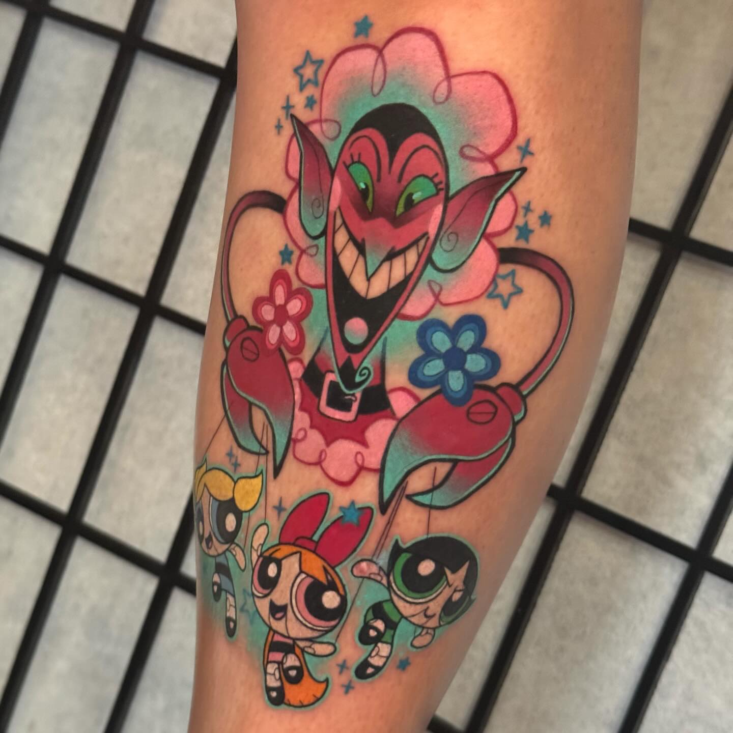 The Powerpuff Girls and Mojo Jojo new school tattoo on the forearm by Taylor Nicoll Chunn