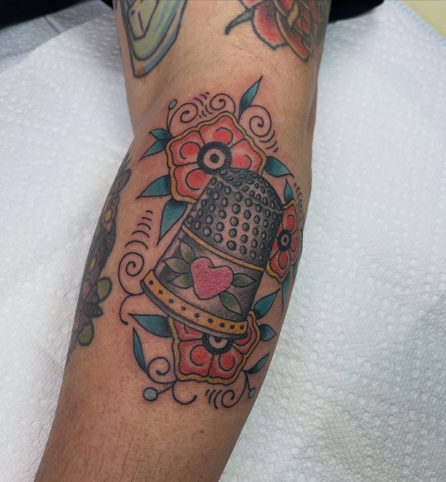 Teapot and floral American traditional tattoo on the forearm by Brian Mcfadden