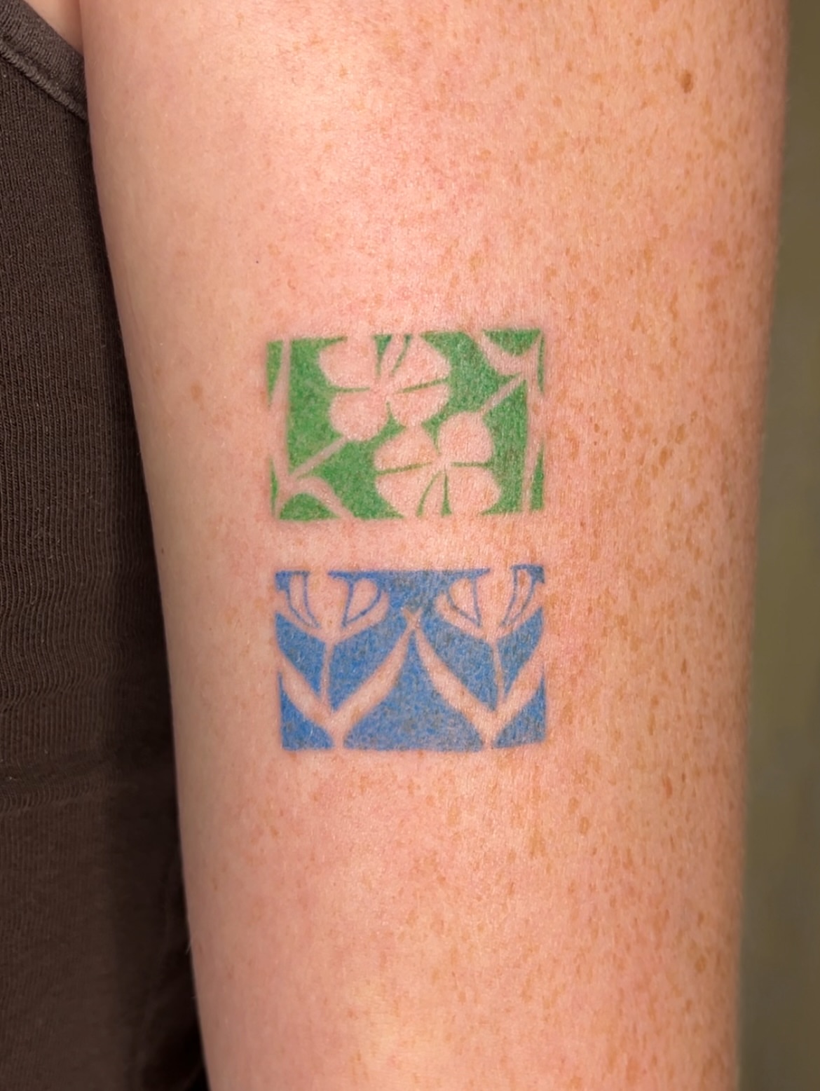 Floral pattern geometric tattoo on the forearm by mia