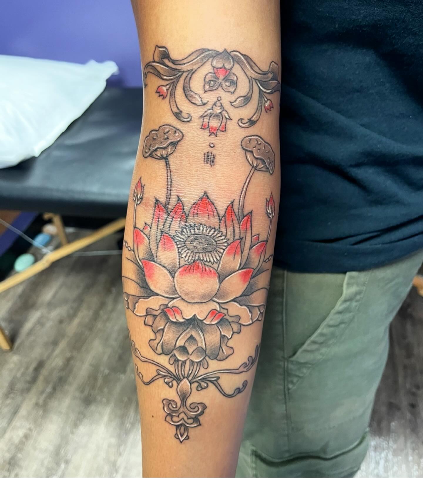 Lotus flower neo-traditional tattoo on the forearm by Mark Calloway