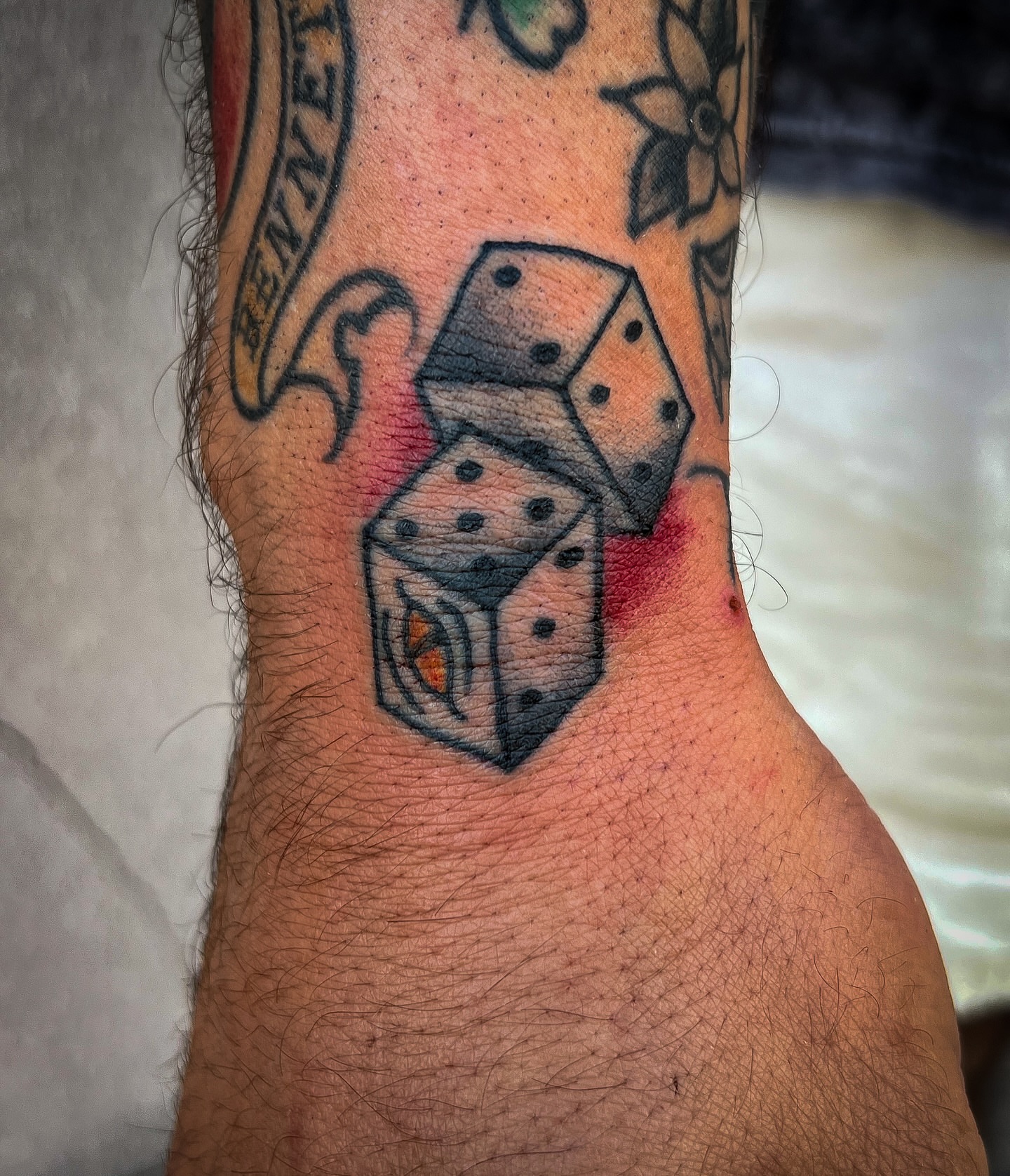 Dice American traditional tattoo on the forearm by Scott Allen