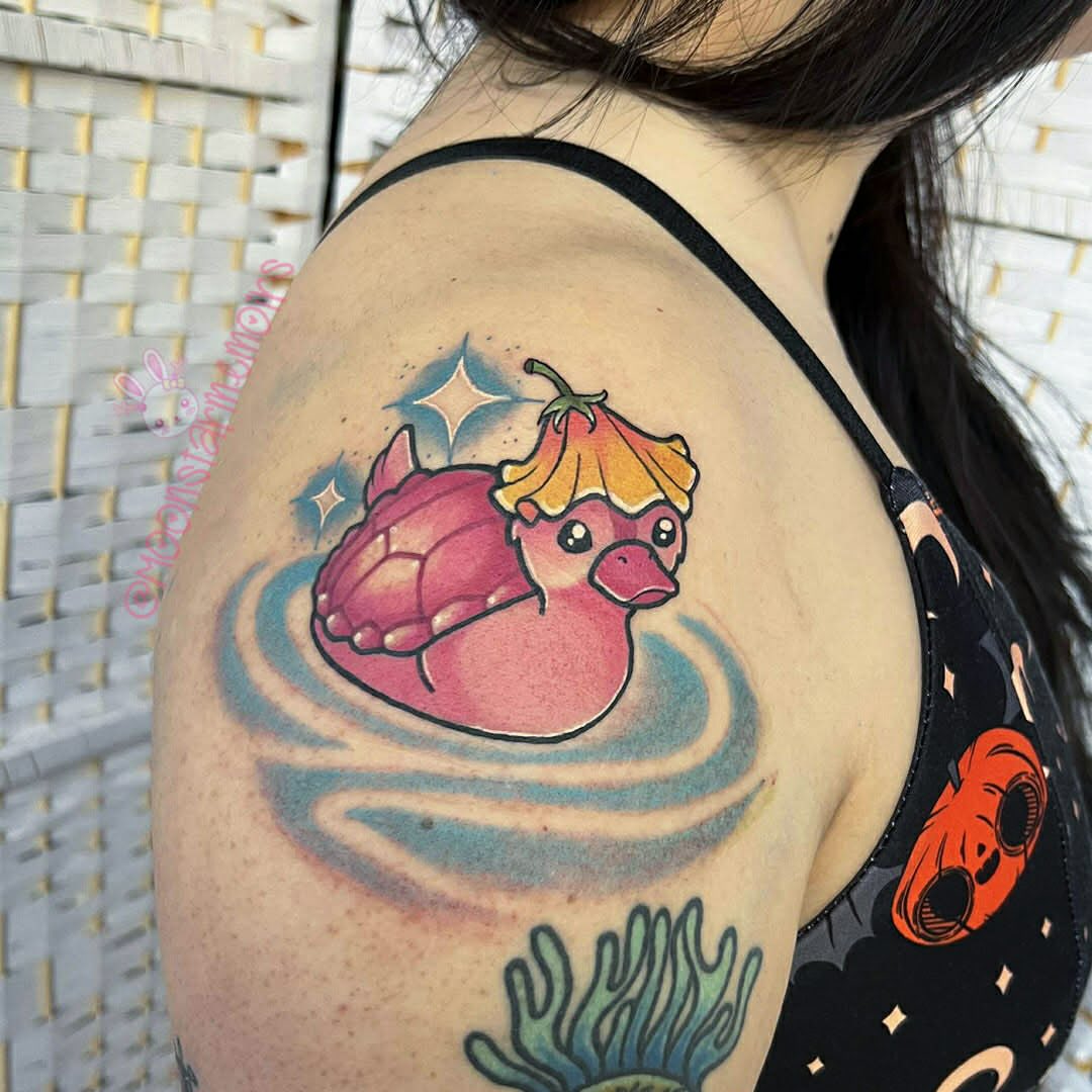 Duck with pumpkin hat new school tattoo on the shoulder by 𝓑𝓾𝓷𝓷𝔂 𝓓. 𝓥𝓪𝓷𝓒𝓸𝓮𝓿𝓮𝓻𝓲𝓷𝓰