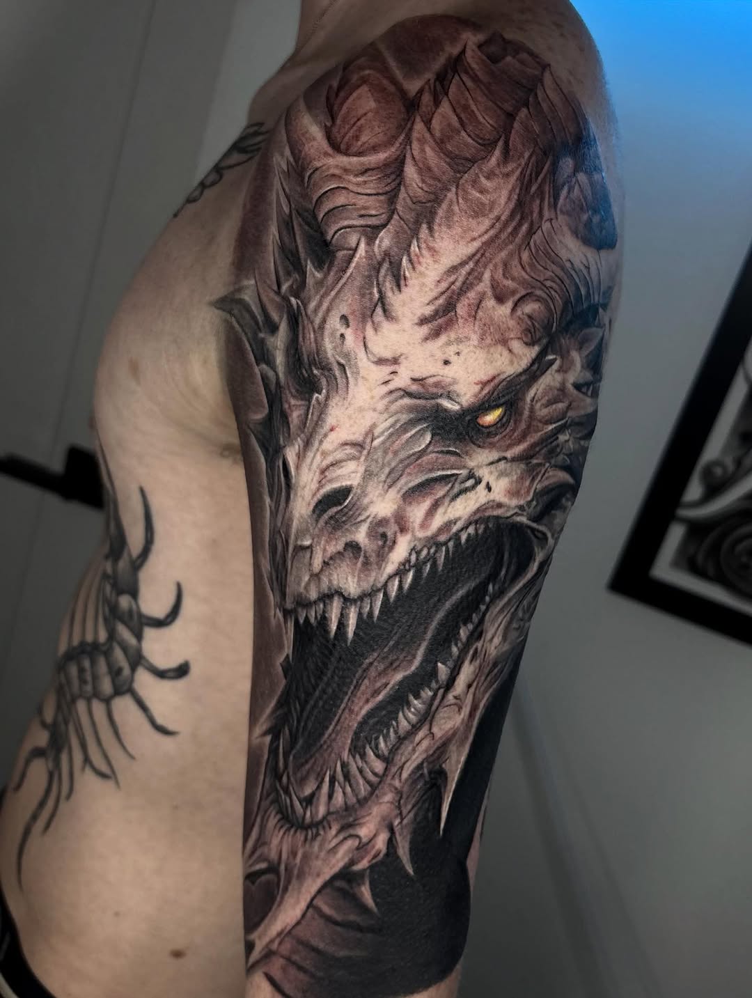 Dragon head realism tattoo on the forearm by Jayden A