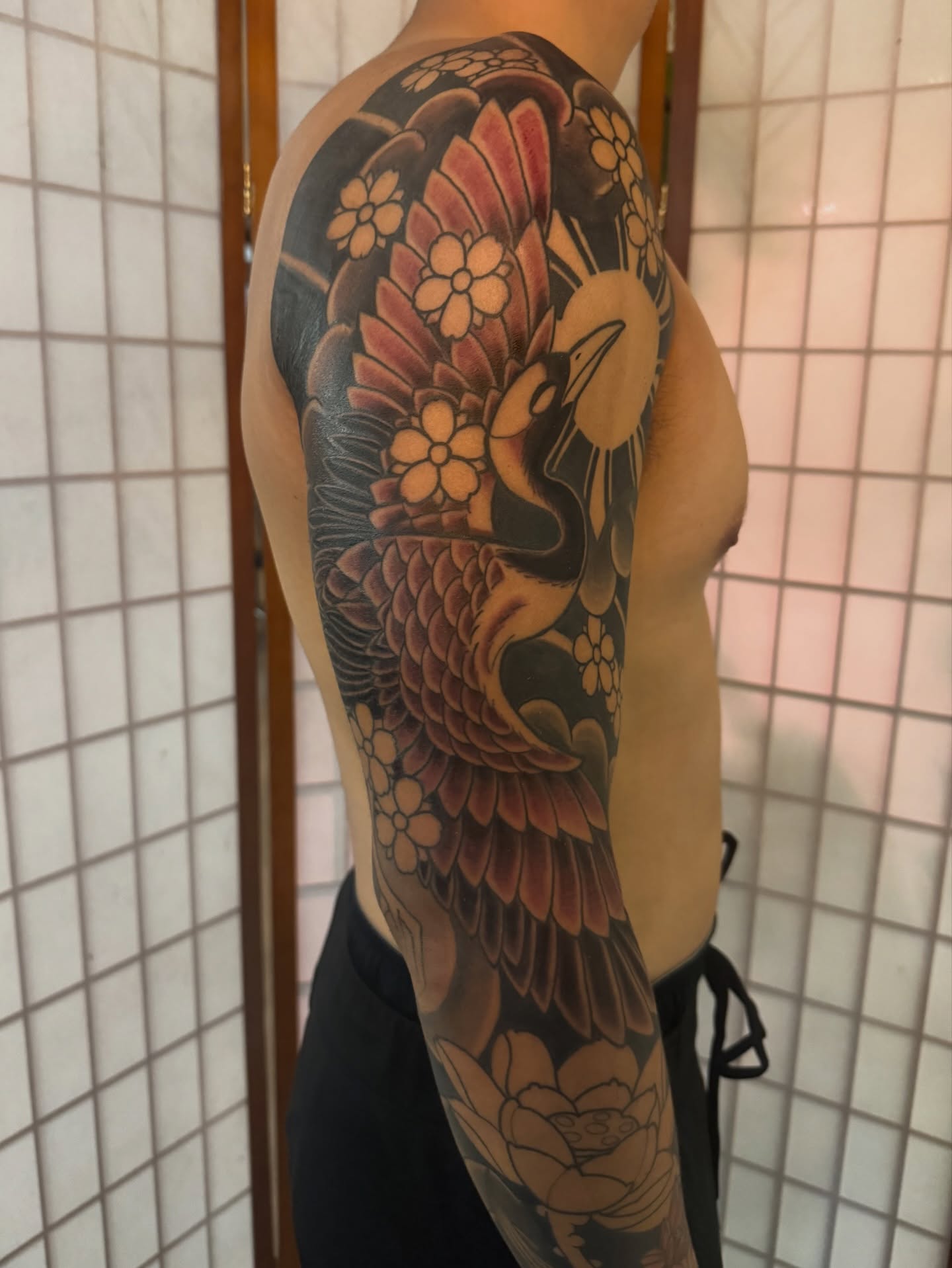 Peacock and flowers japanese irezumi tattoo on the upper arm by Dylan