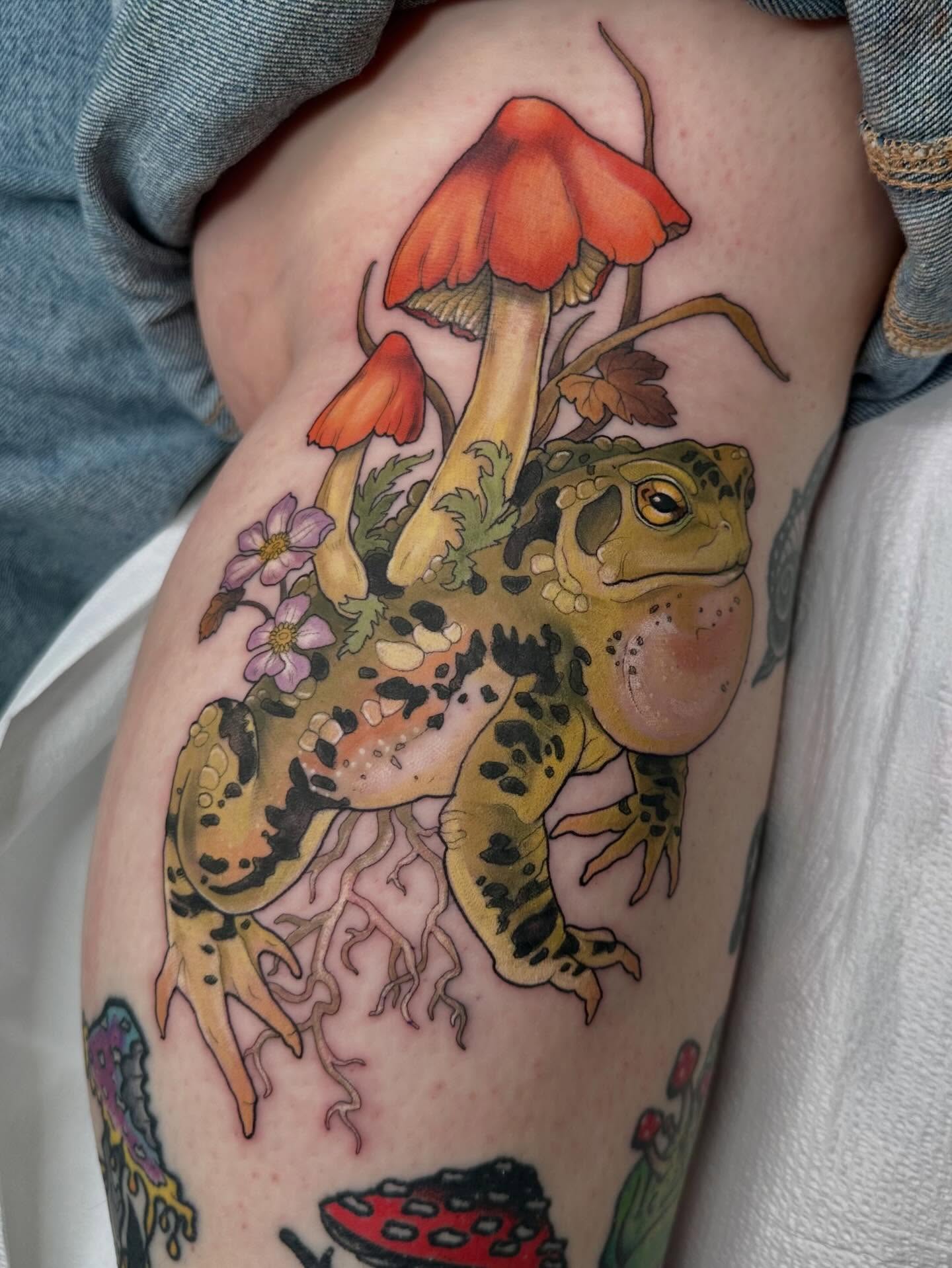 Toad and mushrooms illustrative tattoo on the thigh by Cassidy Depew, Seattle, Washington