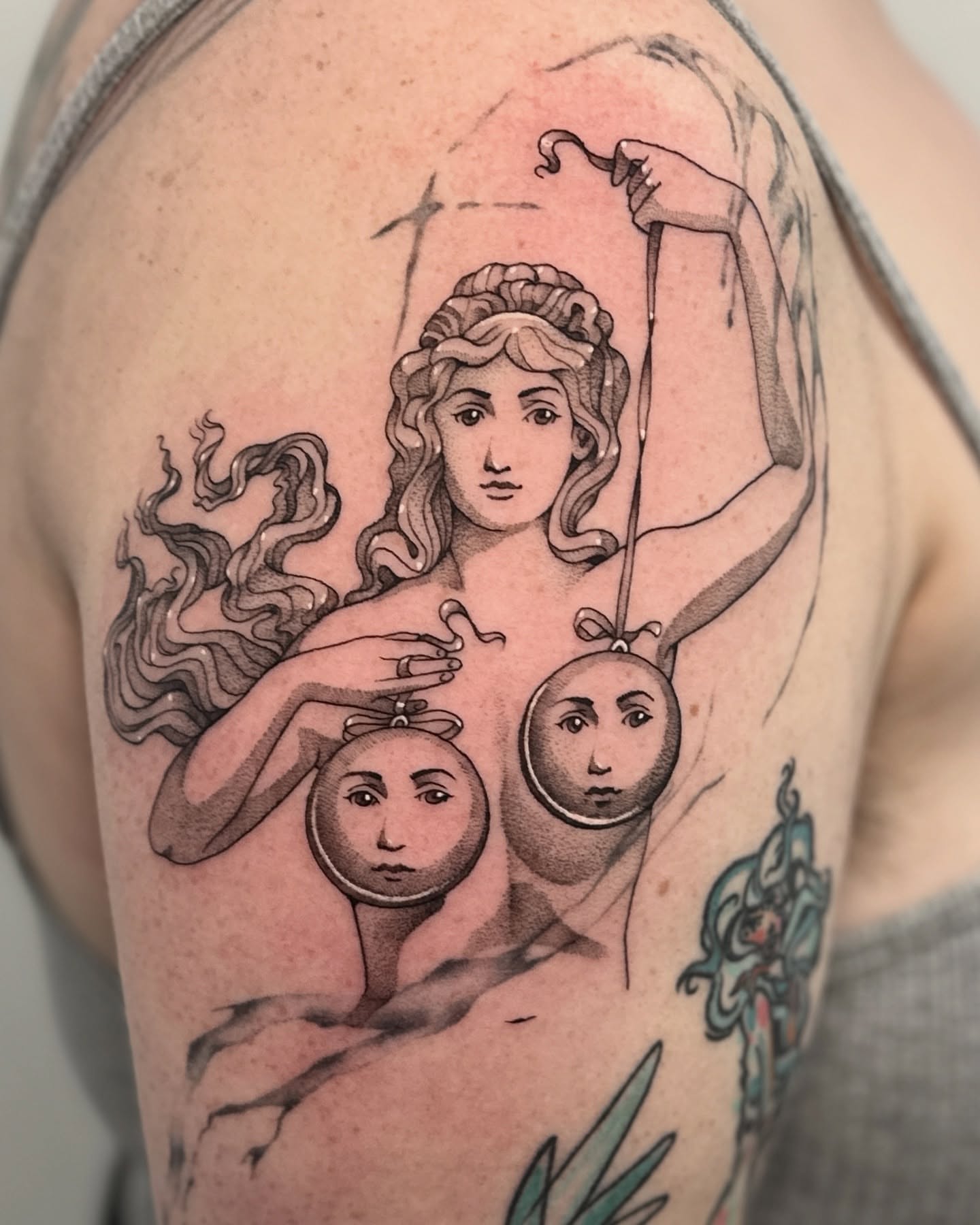 Woman with spheres black and grey tattoo on the shoulder by Connor🍄🏳️‍⚧️