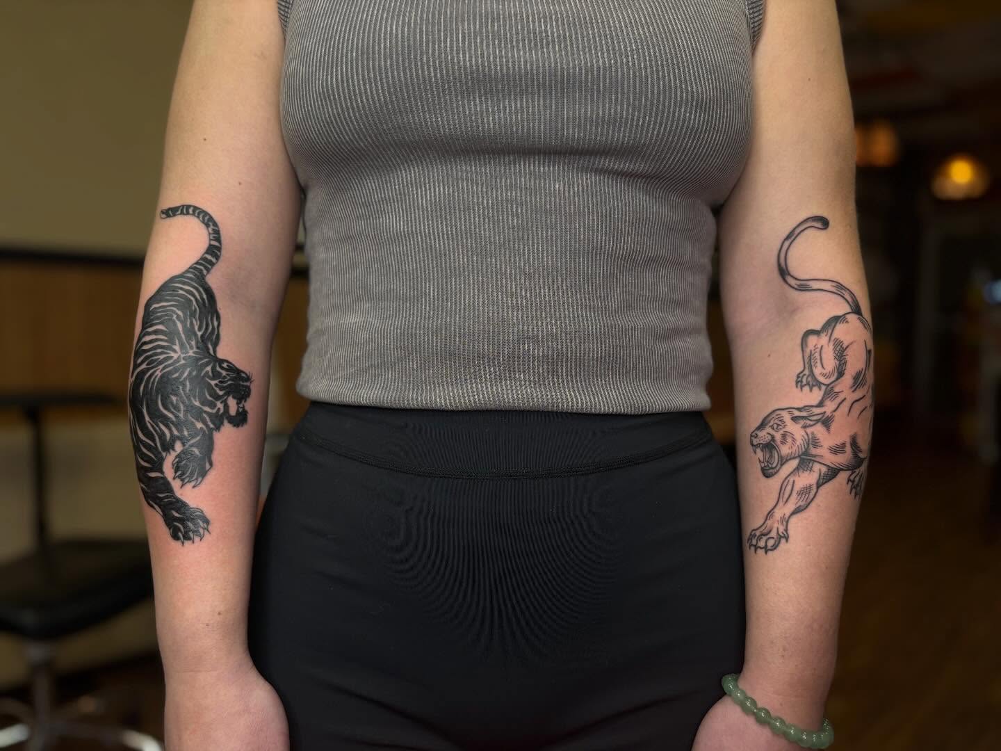 Tiger black and grey tattoo on the forearm by Lauren Deets