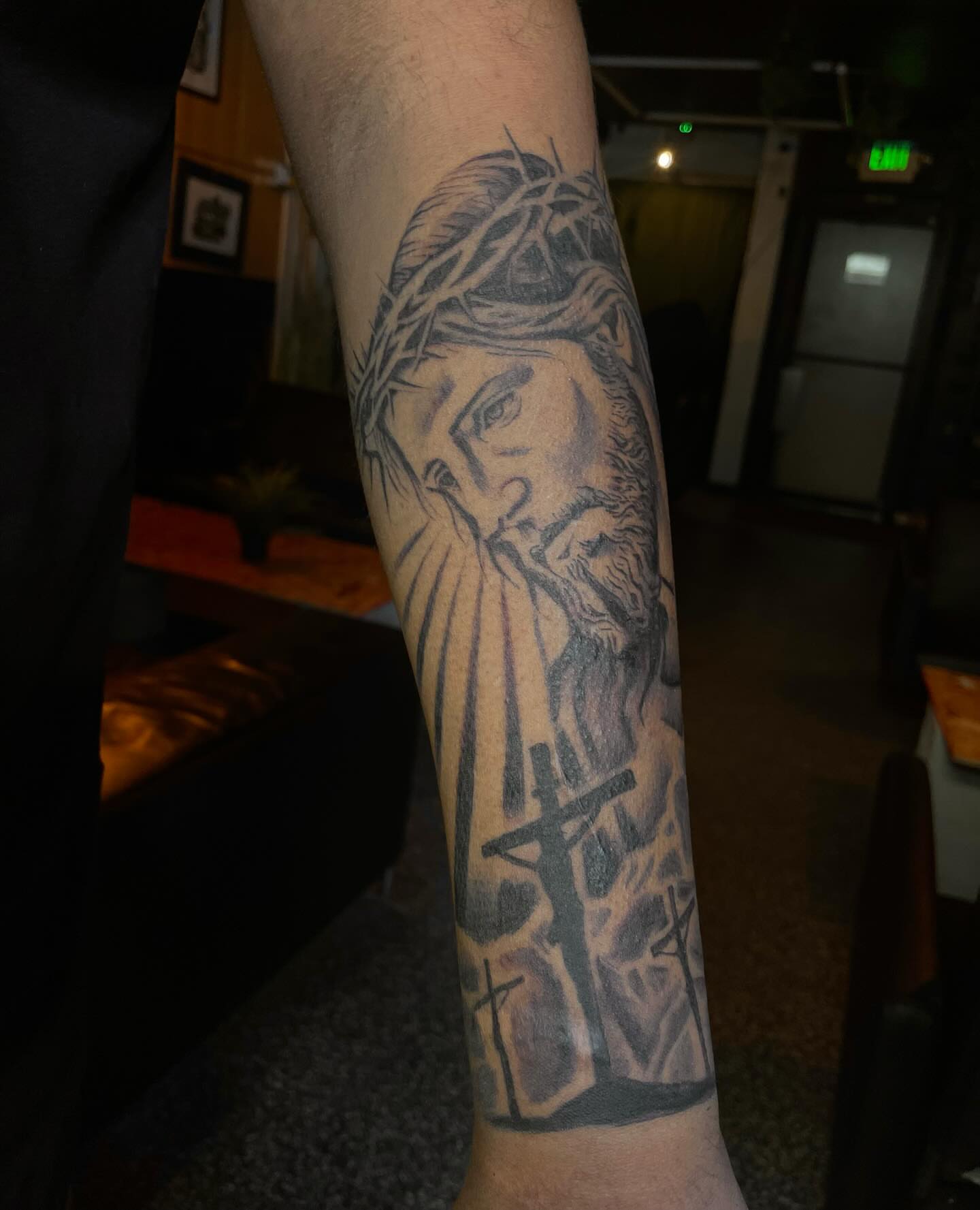 Jesus Christ realism tattoo on the forearm by Trinity