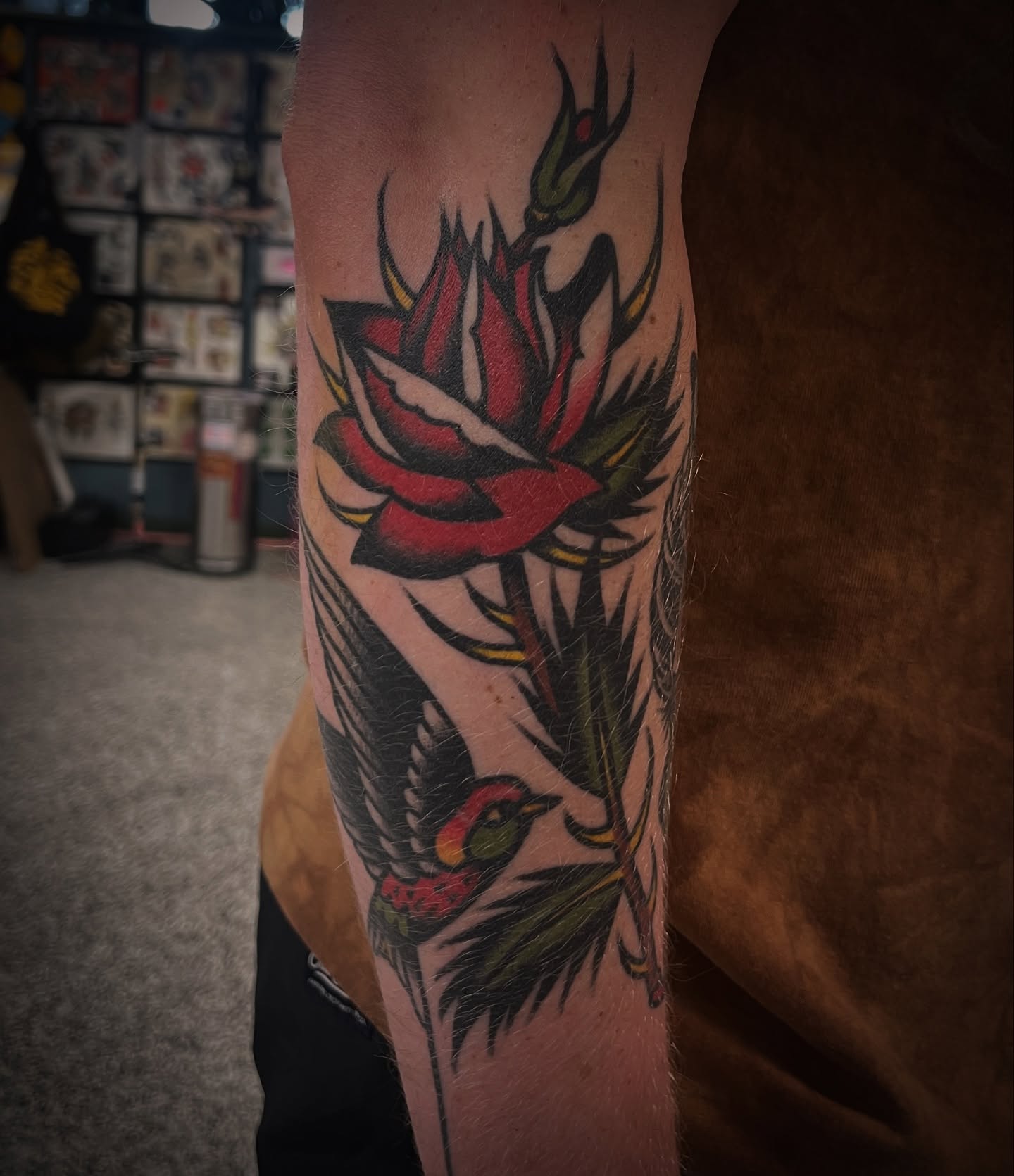 Rose and bird American traditional tattoo on the forearm by Deya Aven, Nashville, Tennessee