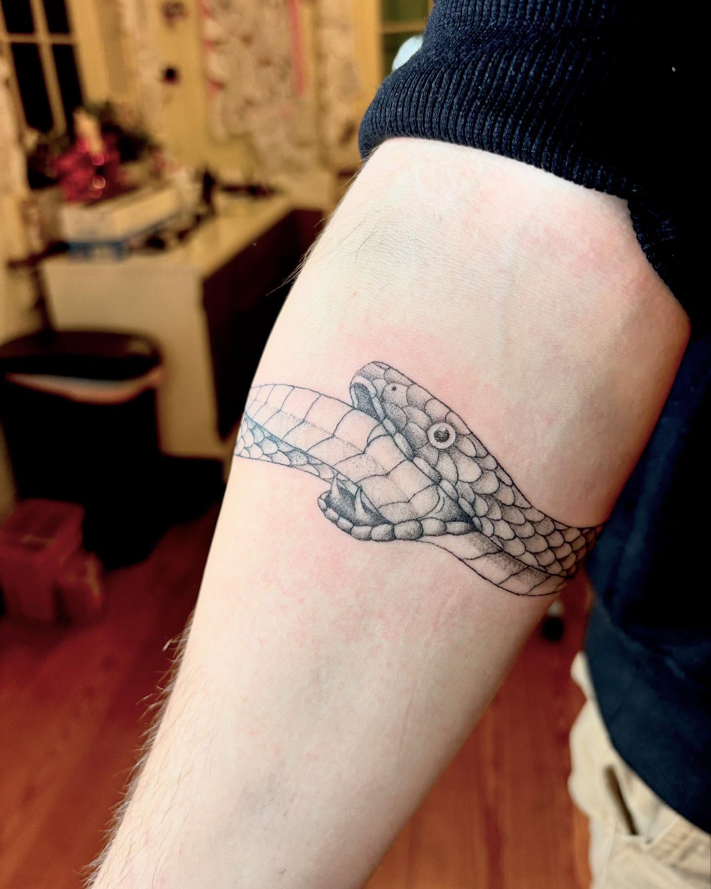 Snake black and grey tattoo on the forearm by madison, Cincinnati