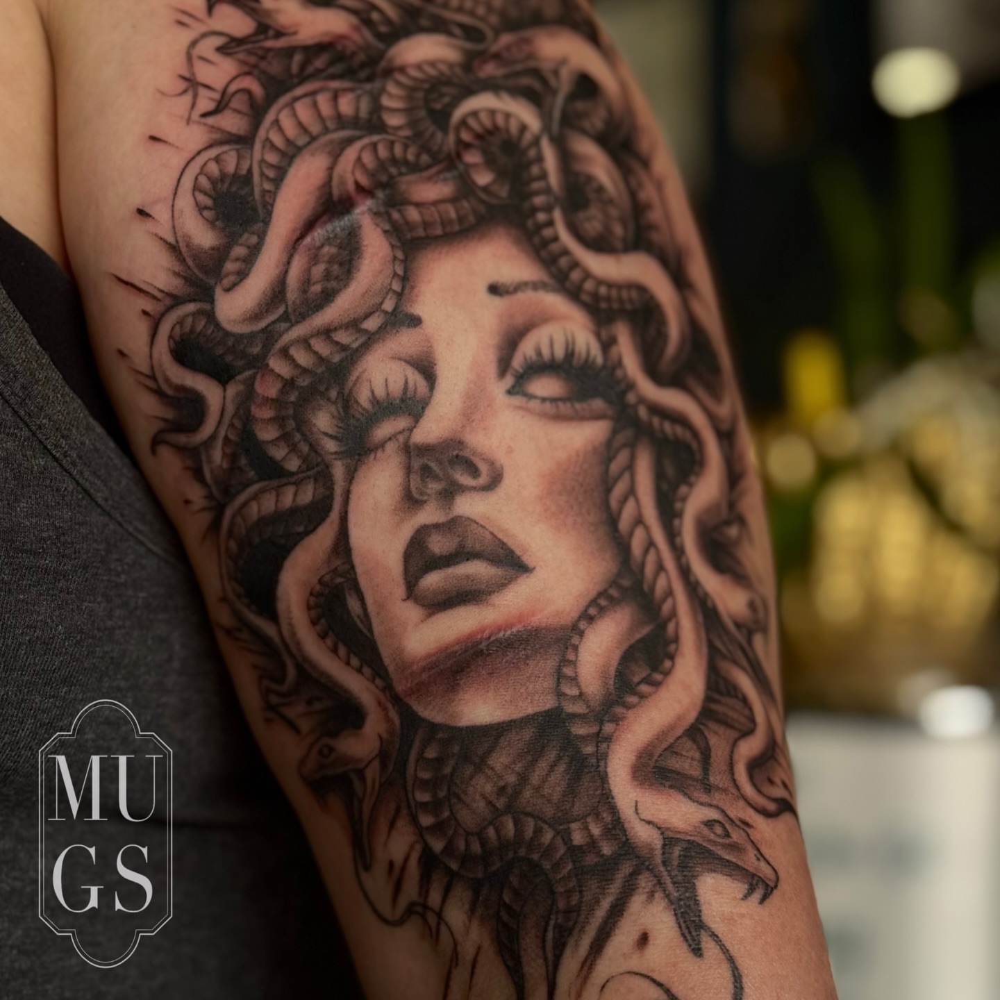 Medusa realism tattoo on the forearm by Emily Andreozzi