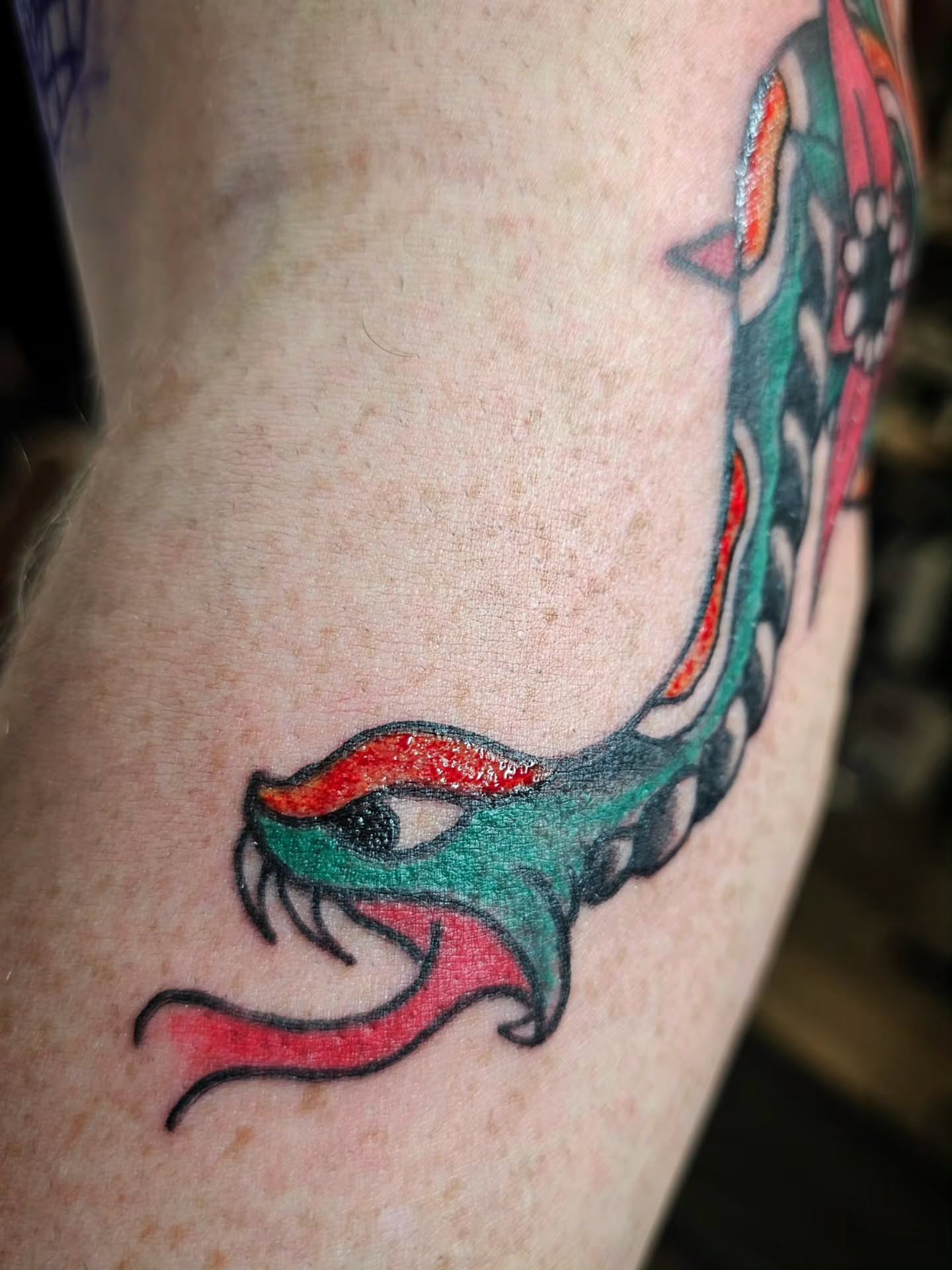 Snake American traditional tattoo on the forearm by J. Arturo Laparra