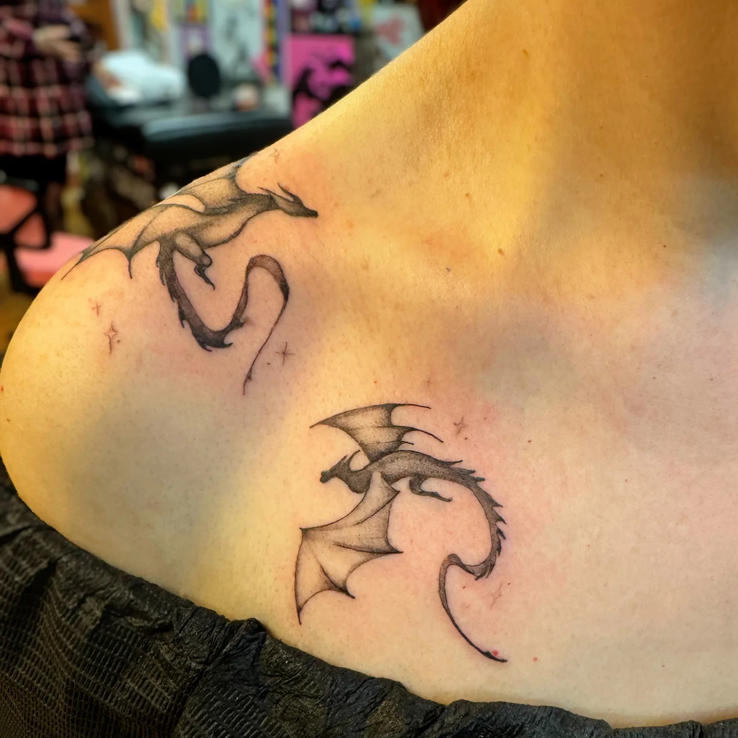 Dragon black and grey tattoo on the shoulder by Niki Jackson