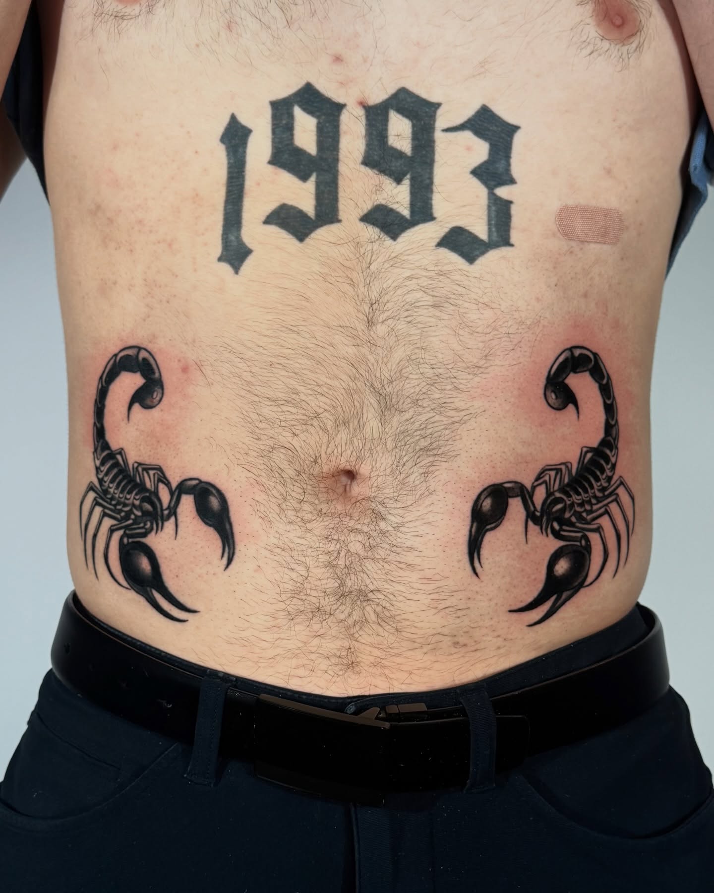 Scorpions and year black and grey tattoo on the torso by Tattoos.byDahlia, Austin, Texas
