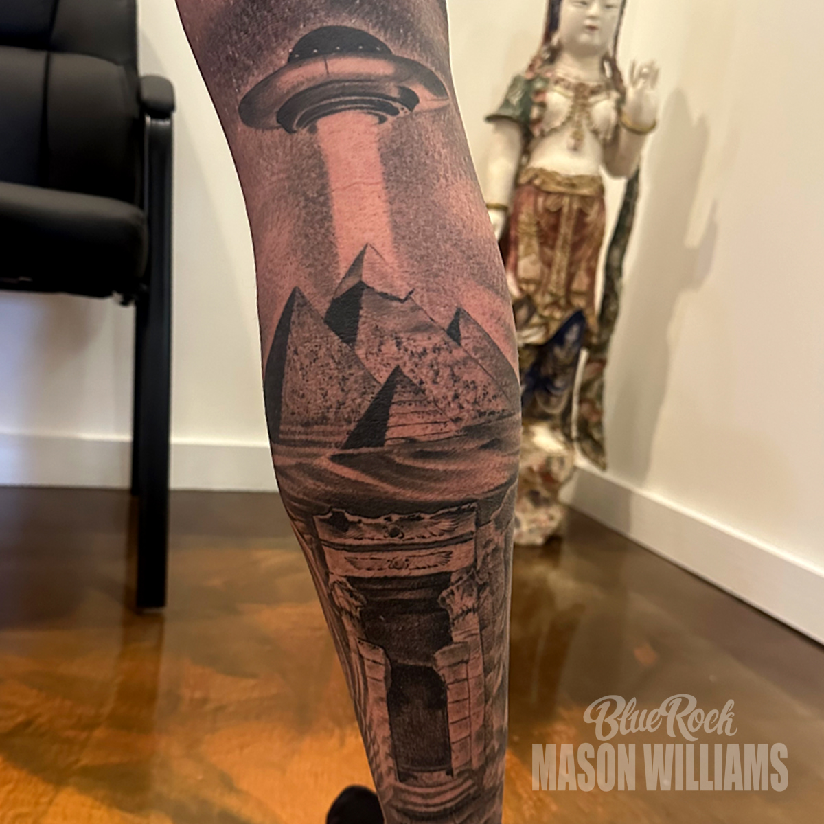 Pyramids and UFO geometric tattoo on the forearm by Mason Williams