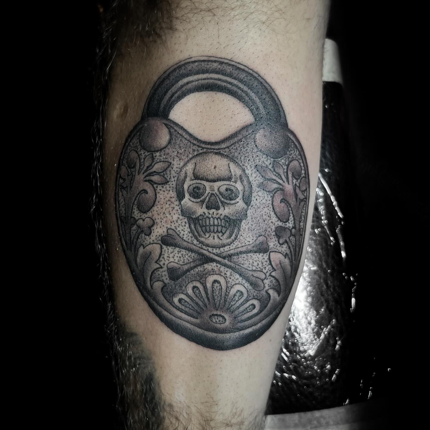 Skull and crossbones black and grey tattoo on the forearm by @sloanxkettering