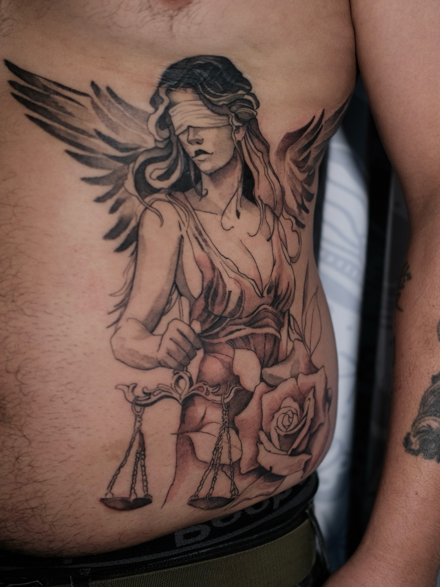 Tattoo by @cordova.ink — black_and_grey, realism