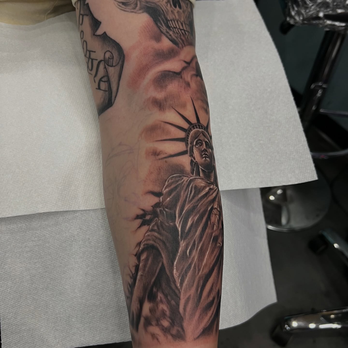 Statue of liberty realism tattoo on the forearm by Tony Hernandez, Chicago, Illinois