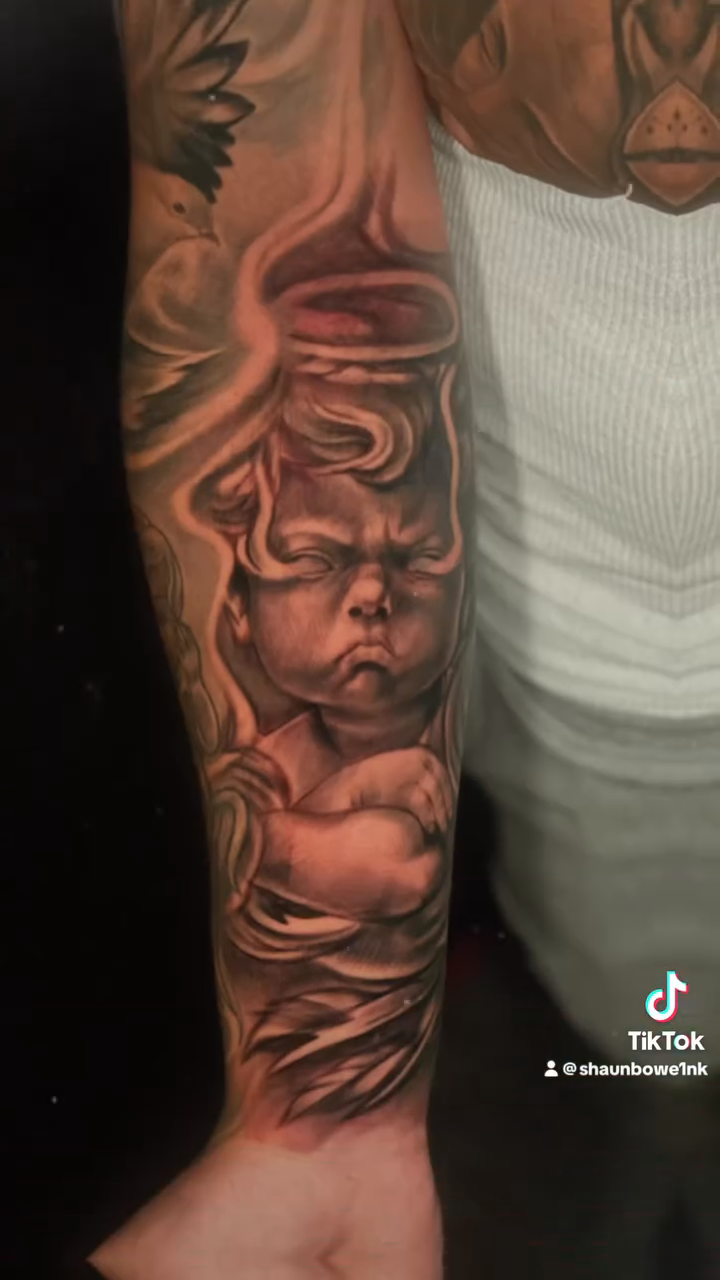 Cherub realism tattoo by Shaunboweink