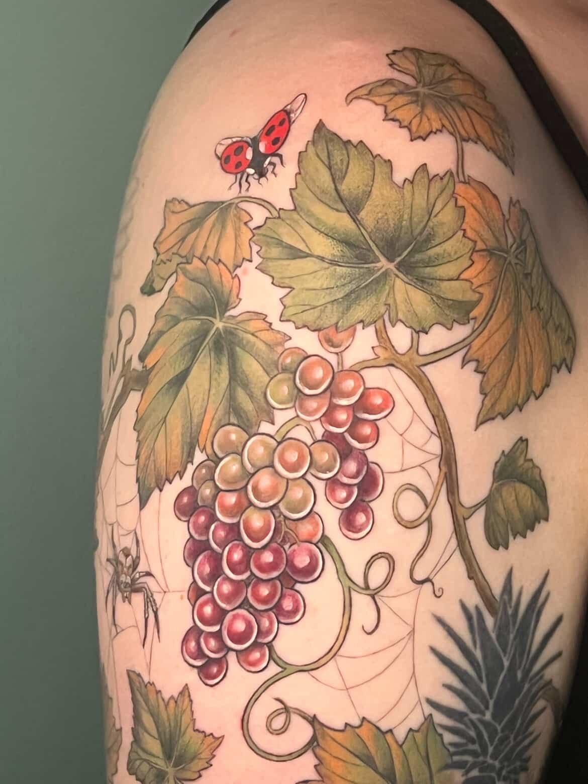 Grapes and leaves realism tattoo on the shoulder by Tattoos by Shashonna - Portland Tattoo Artist