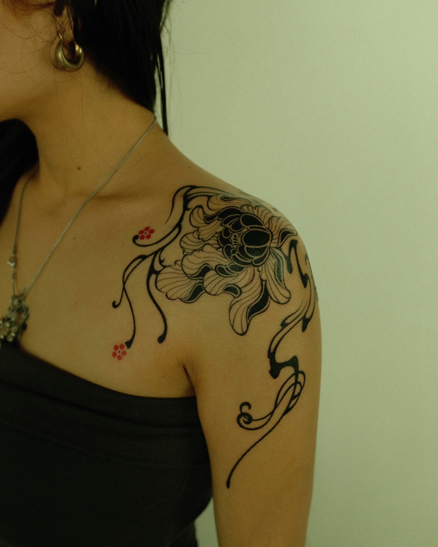 Floral design black and grey tattoo on the shoulder by Xiao Lun