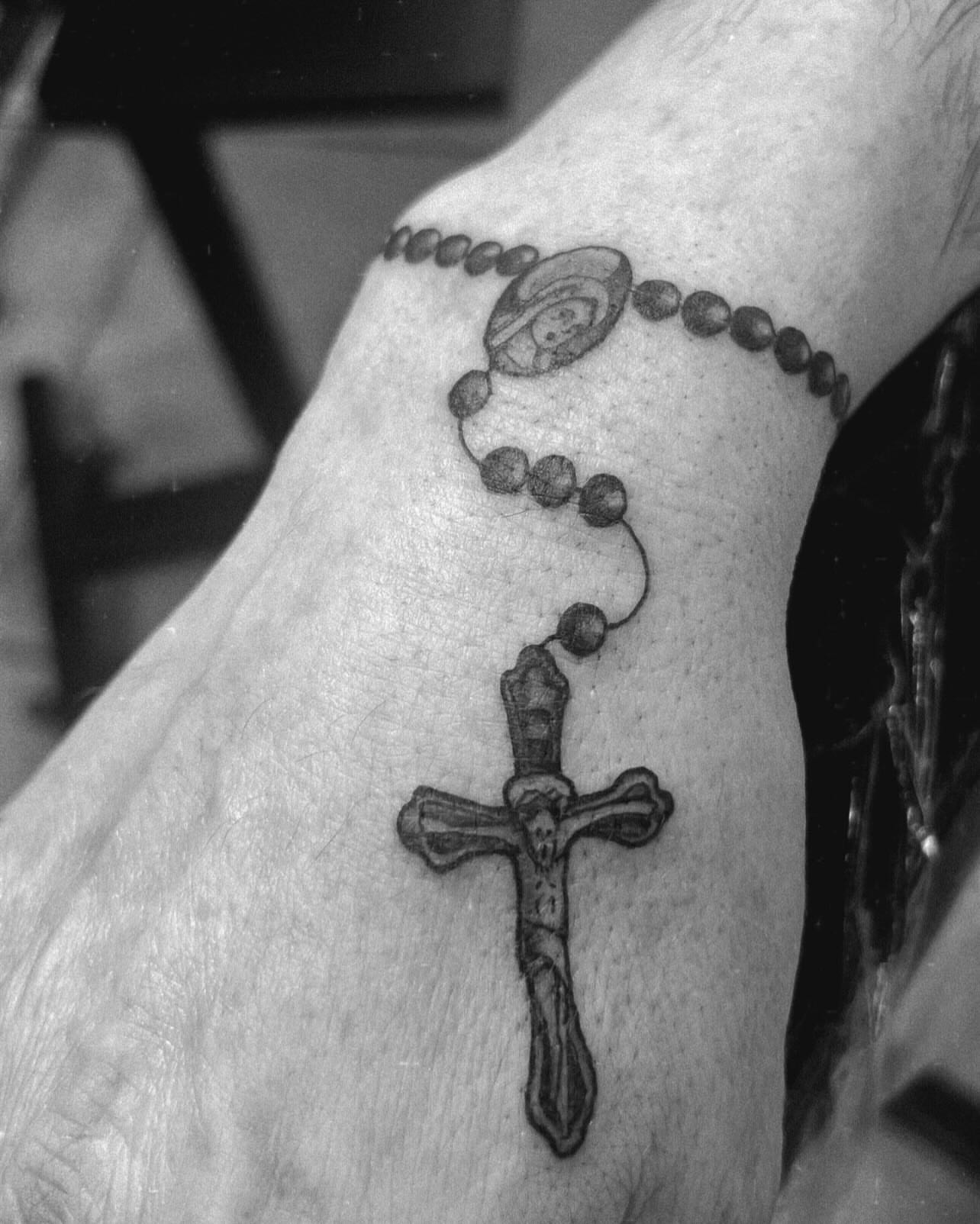 Rosary black and grey tattoo on the forearm by Natalie Phillips, Oakland, California