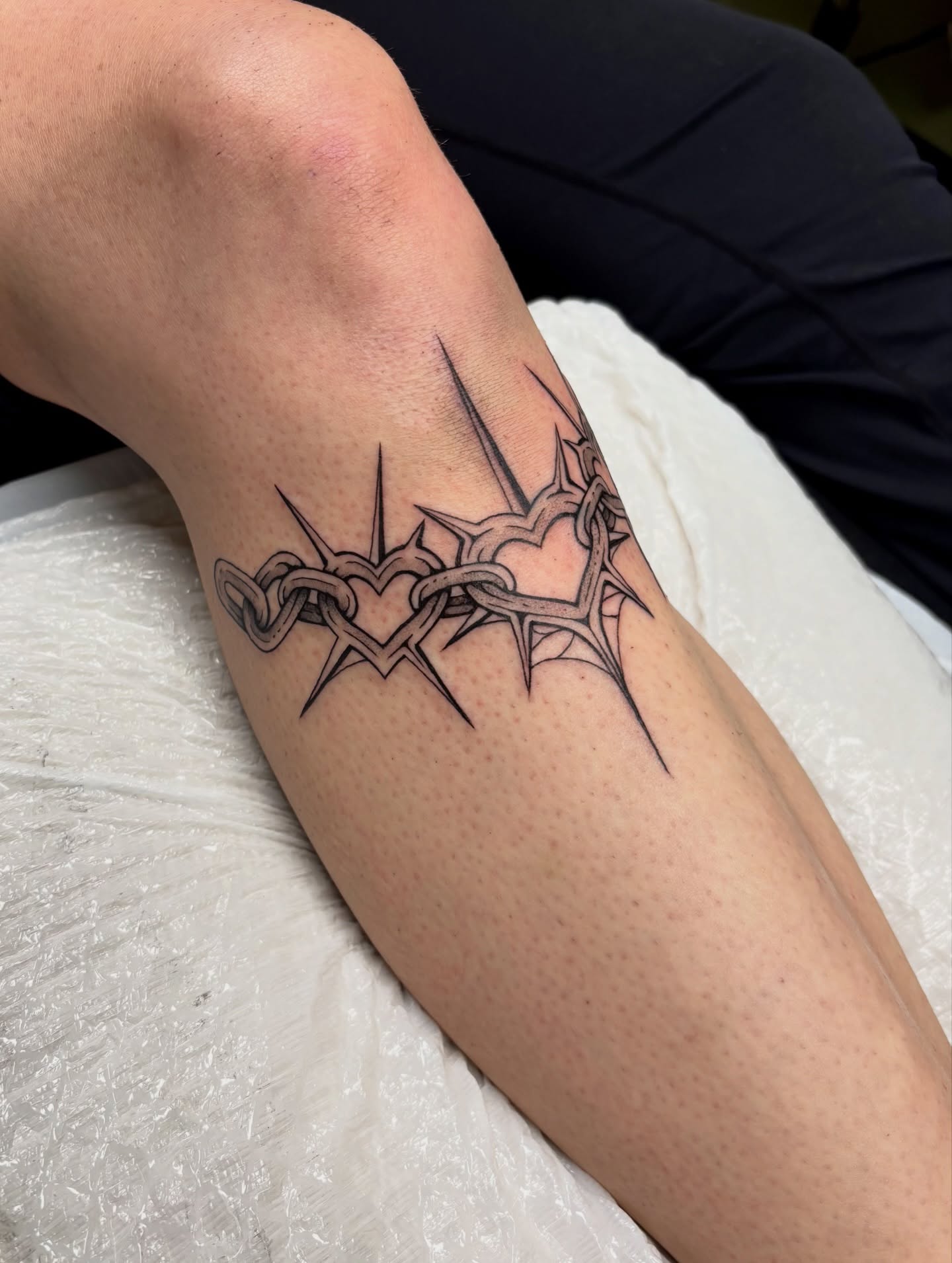 Heart with thorns black and grey tattoo on the forearm by sydney honn