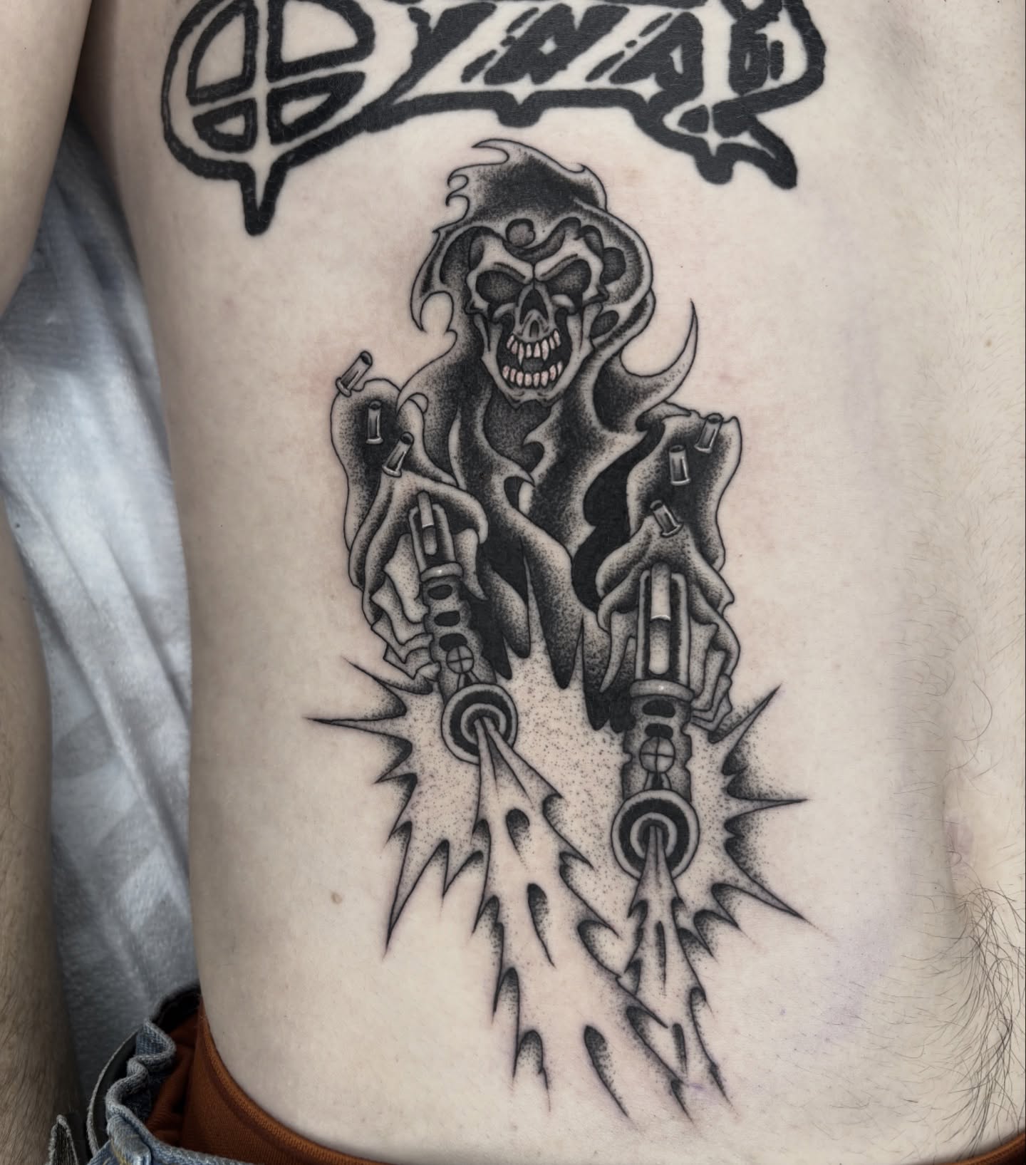Skull with mechanical arms dotwork tattoo on the ribs by Dallas Tattoo Artist