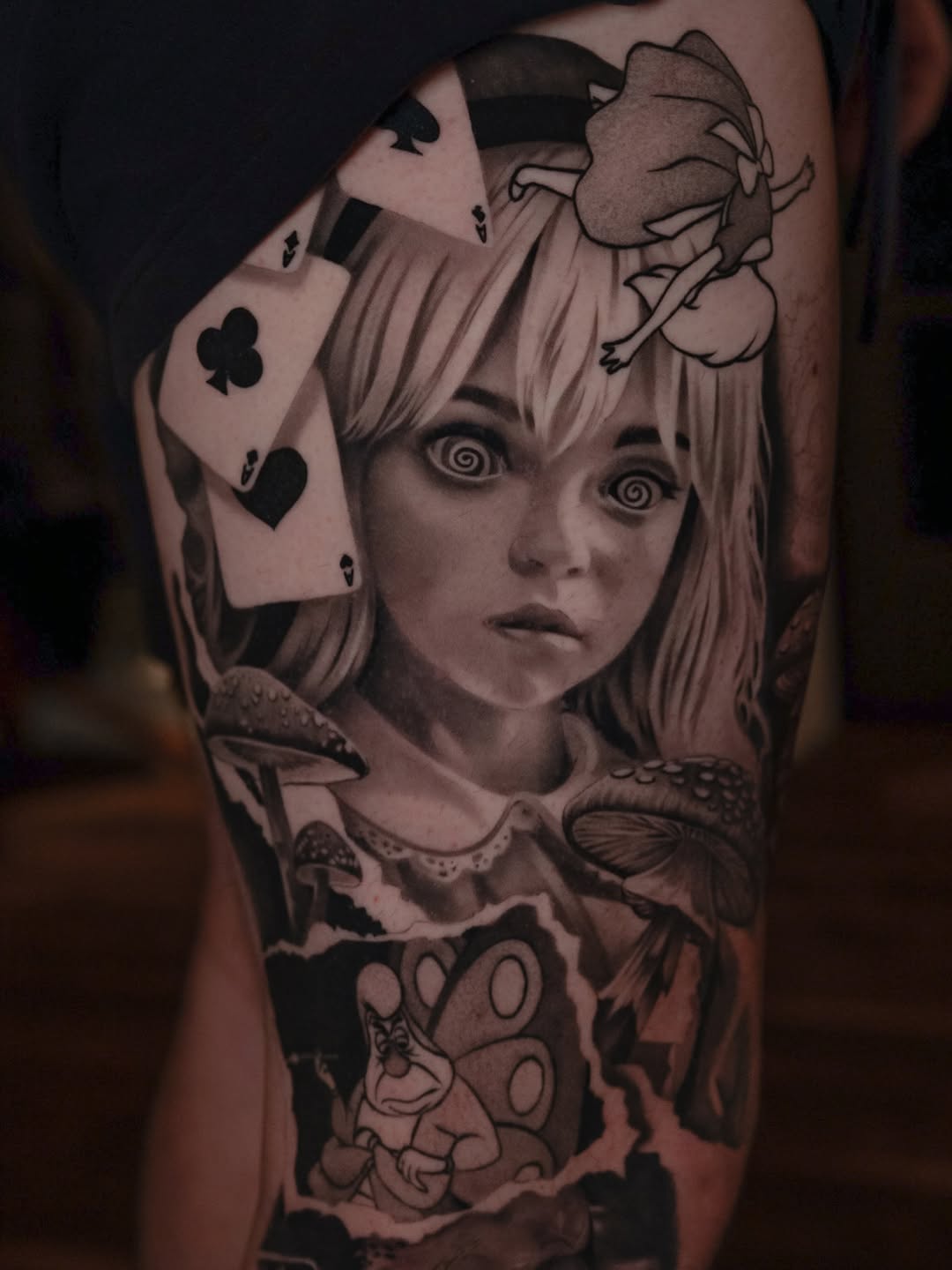 Alice in Wonderland characters and imagery surrealism tattoo on the forearm by @kotytattoos