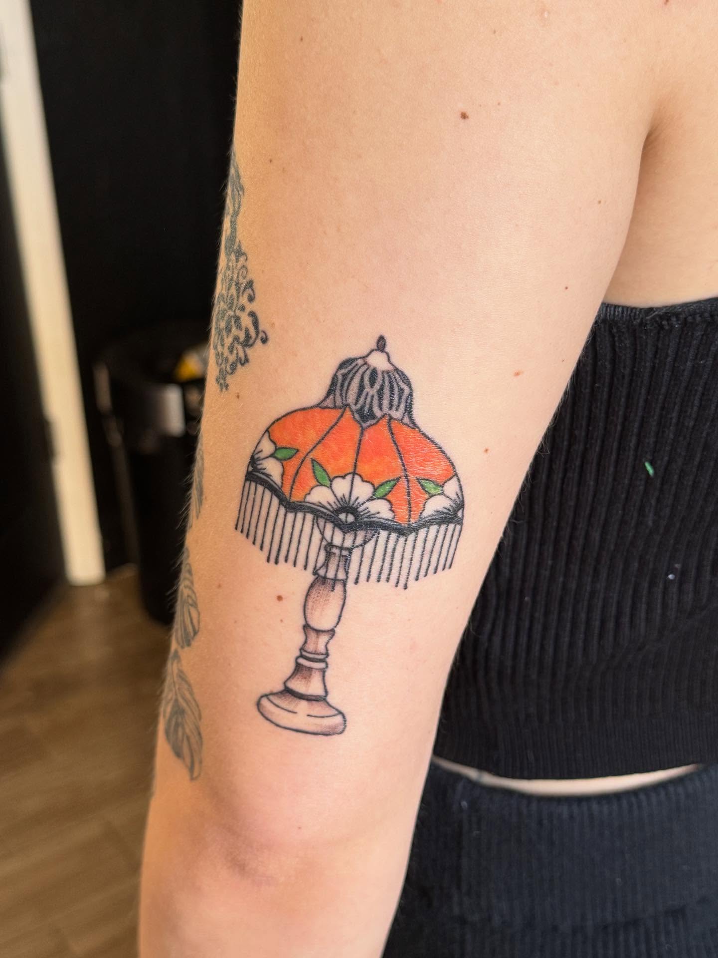 Lampshade American traditional tattoo on the forearm by Mickey