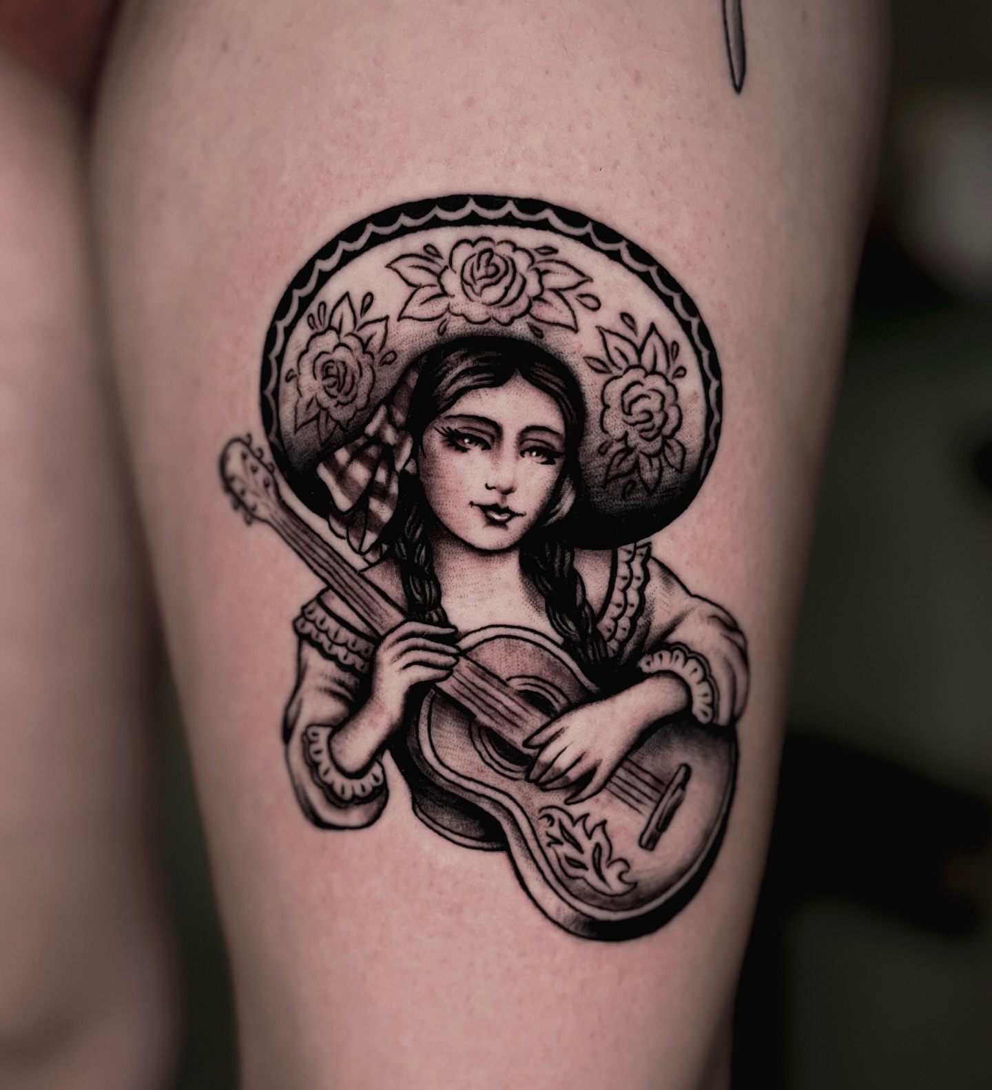 Girl playing guitar realism tattoo on the thigh by Weston Imhoff