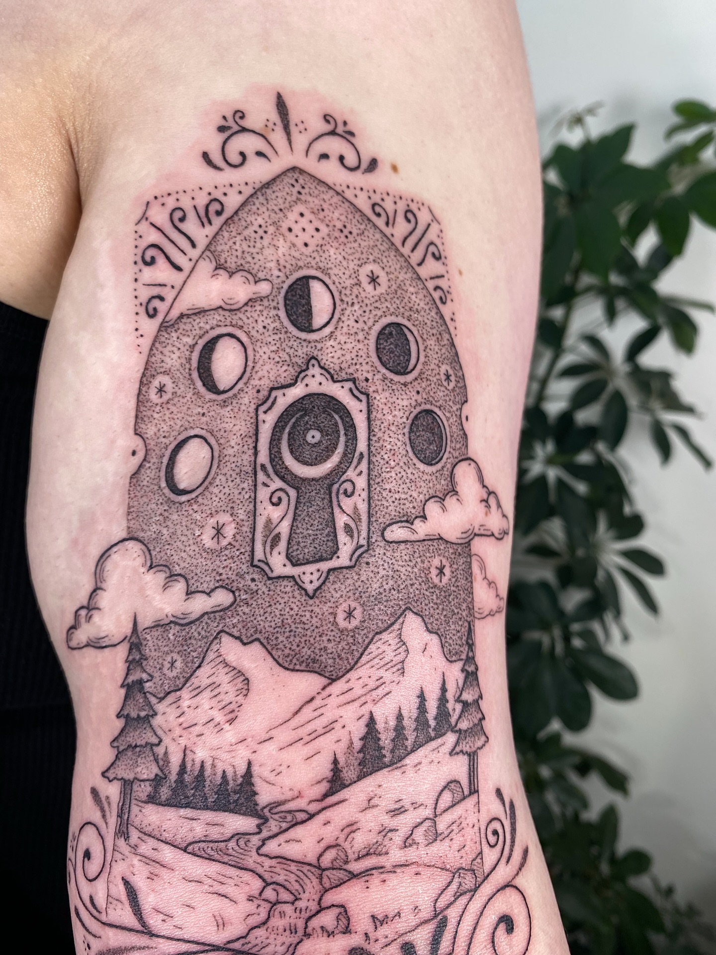 Astronaut door dotwork tattoo on the forearm by Santiago Don, Portland, Oregon