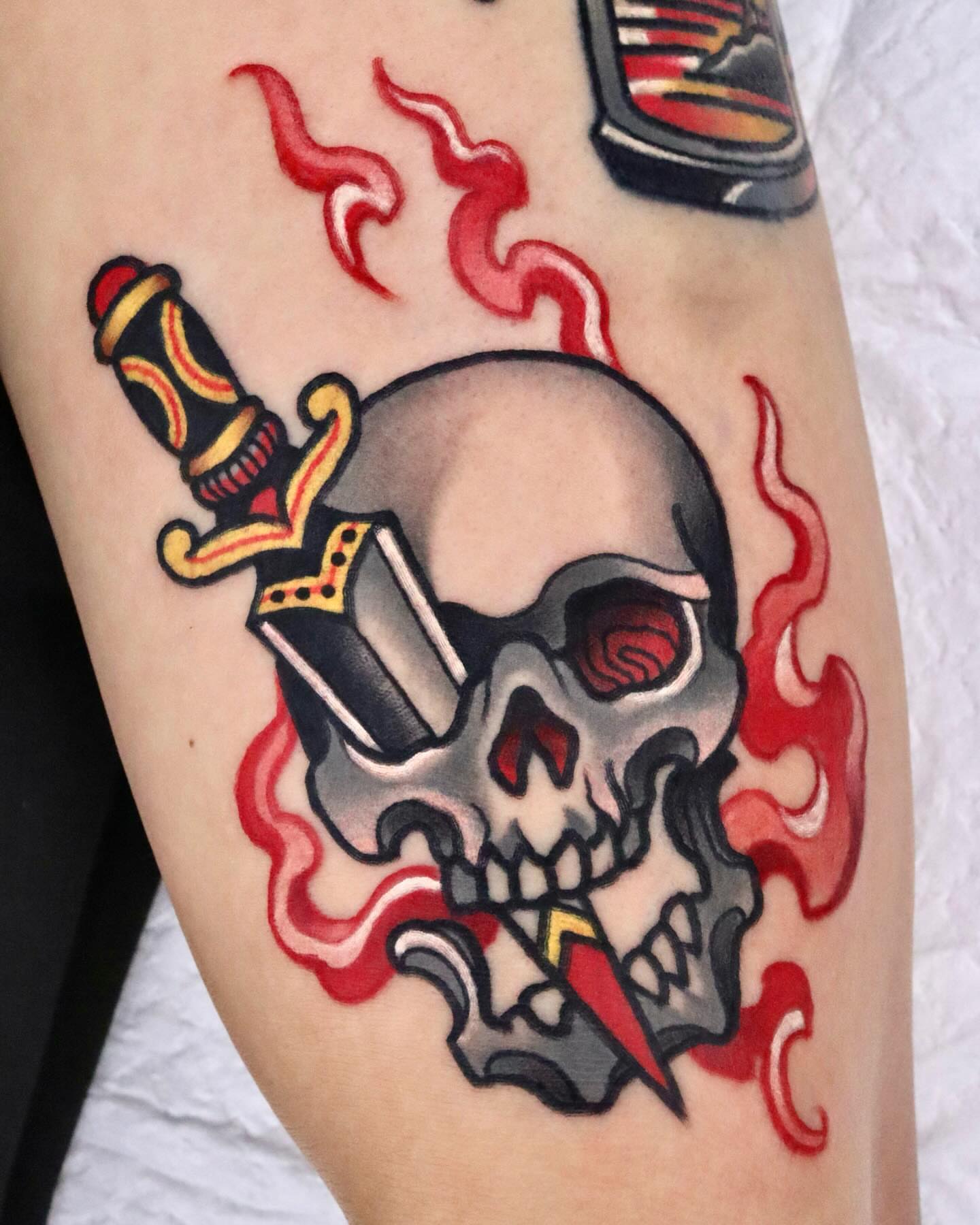 Skull with dagger American traditional tattoo on the forearm by 부산타투
