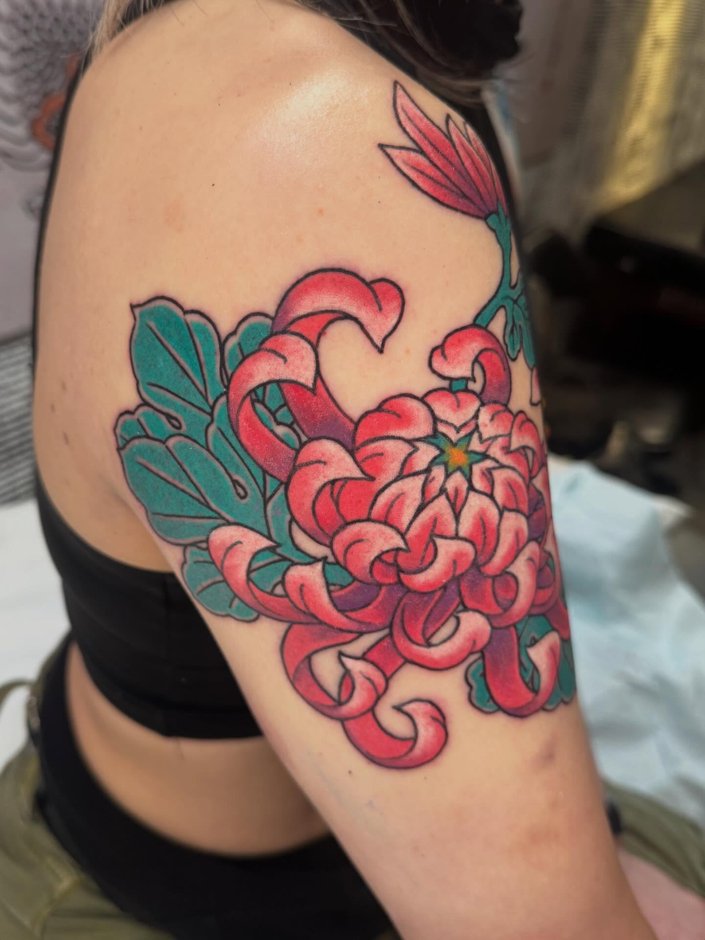 Chrysanthemum American traditional tattoo on the shoulder by Mr Nikita, New York, New York