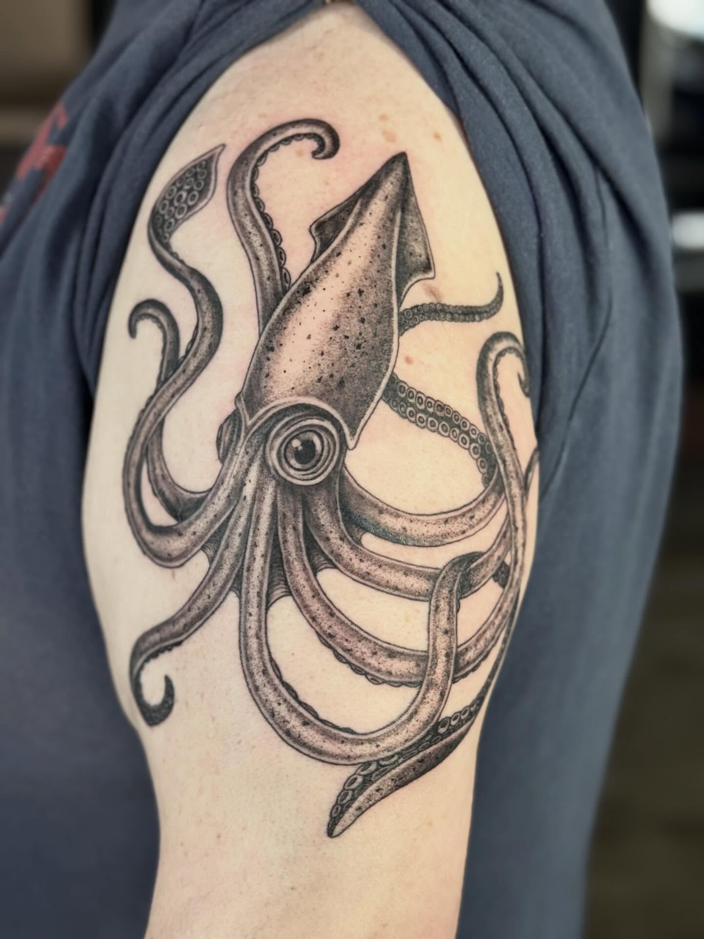 Squid dotwork tattoo on the shoulder by @carissaetattoos