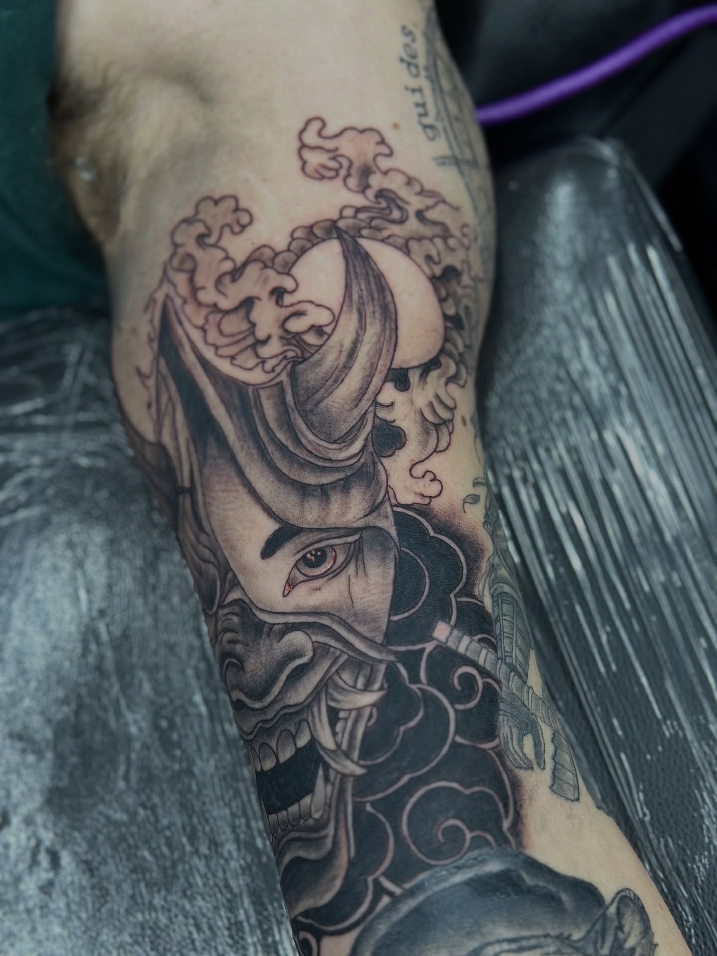 Samurai helmet black and grey tattoo on the forearm by Sk Pierce